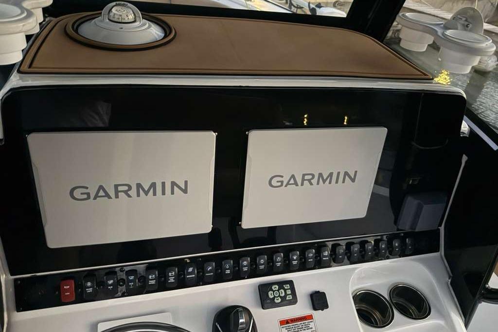 2021 Sea Hunt Gamefish 30 dashboard with dual Garmin displays and controls.