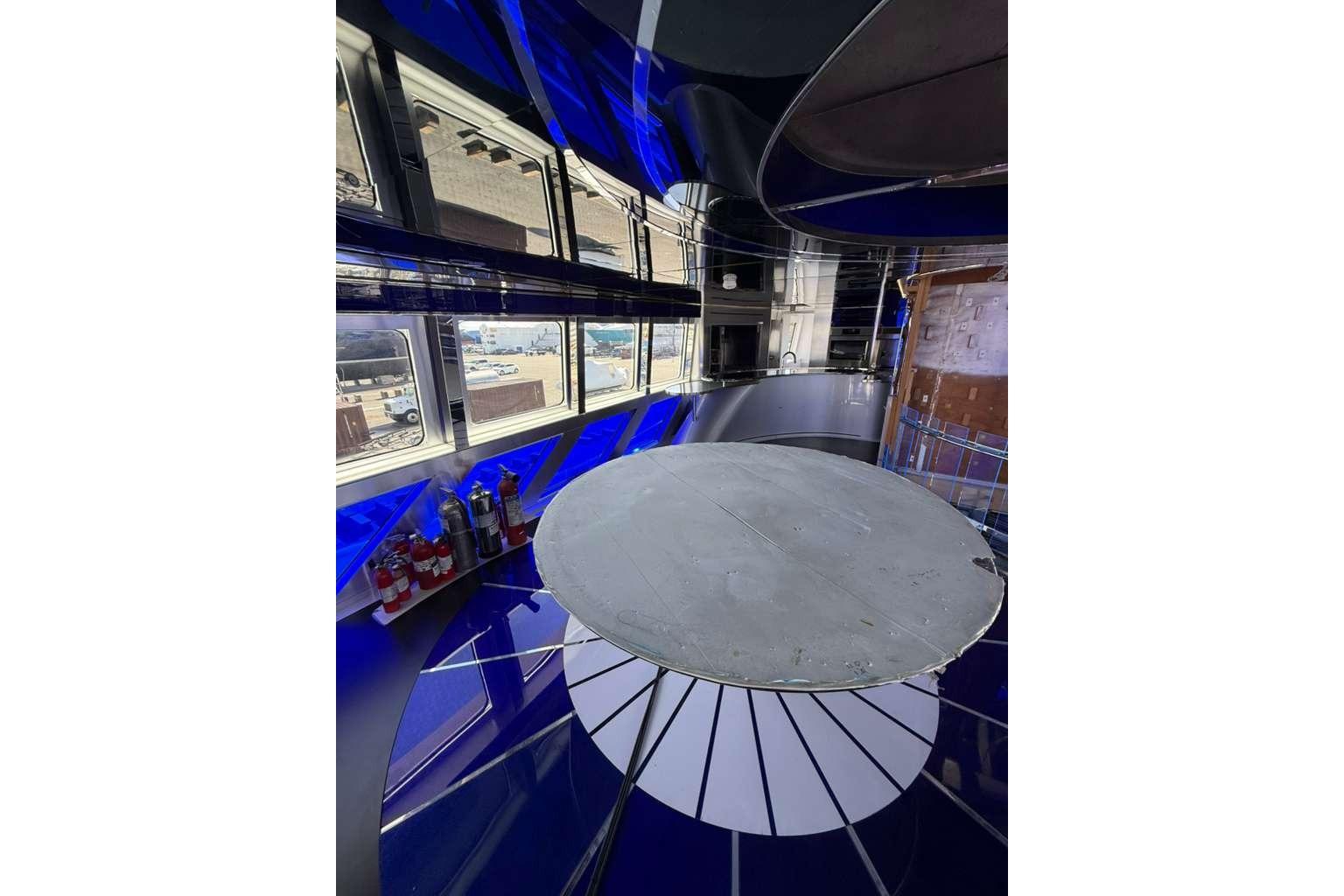 Interior of 1992 Heesen 141 Motor Yacht with modern design and large windows.