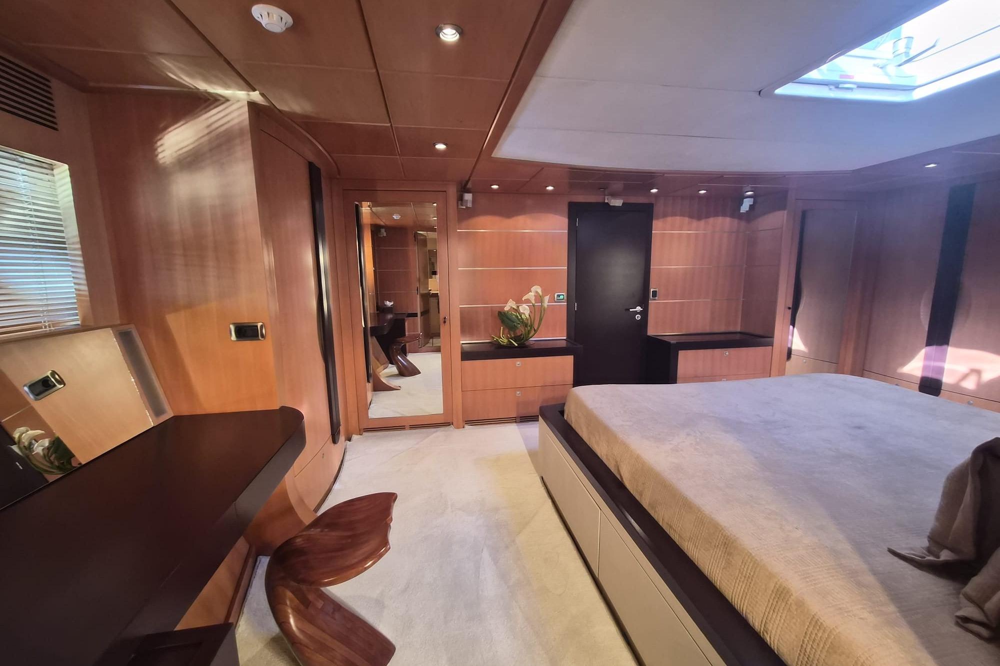 Luxurious cabin interior of 2004 Dereli S/Y 39 m yacht with elegant wood paneling.