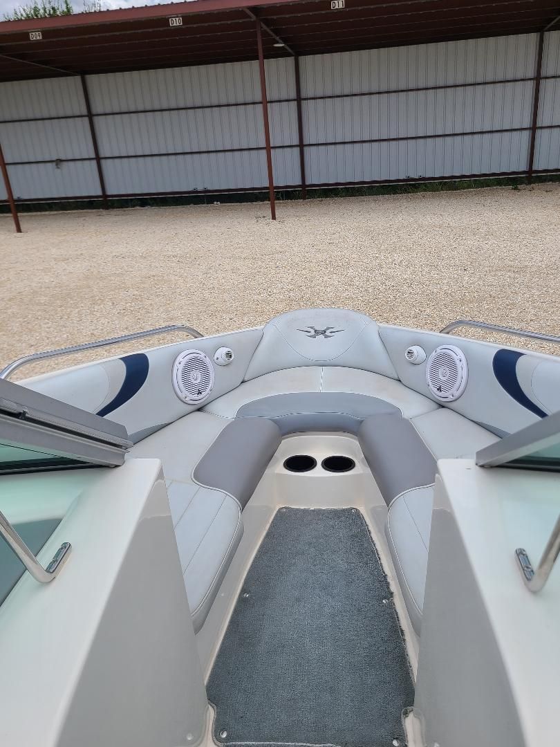 2003 MasterCraft X-9 boat interior with gray seating and speakers.