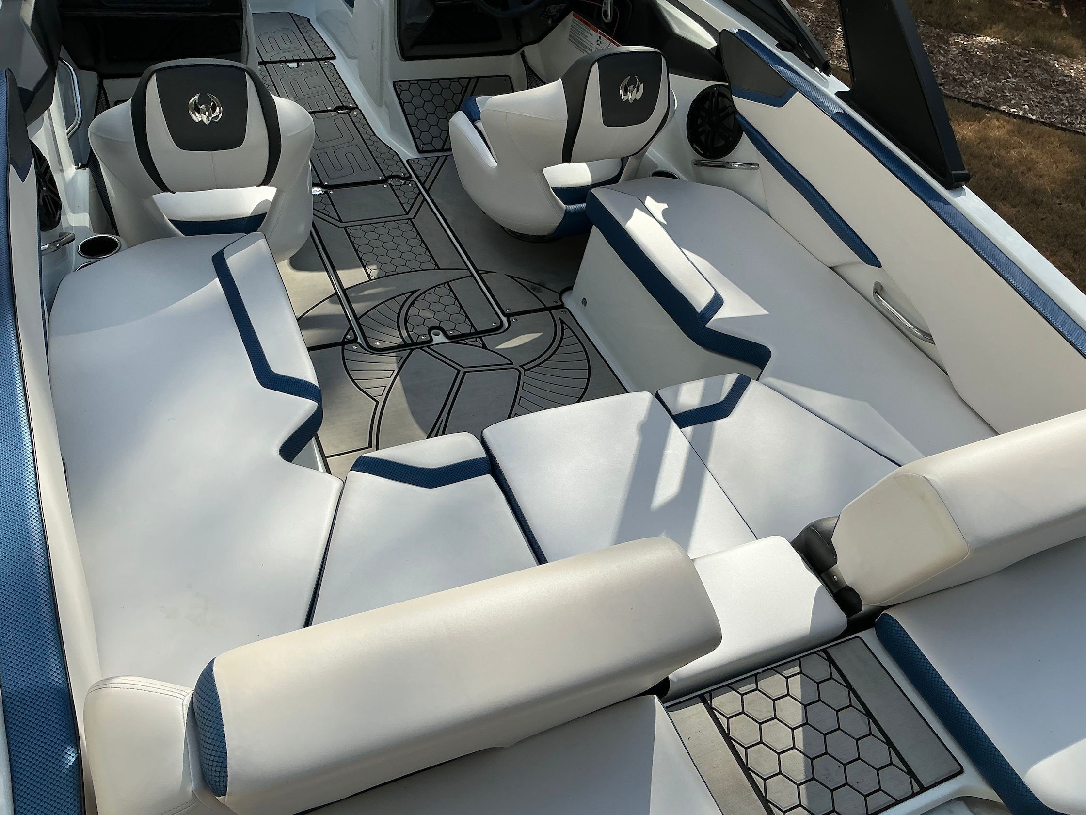 Interior of a 2021 Scarab 215 ID boat with stylish seating.