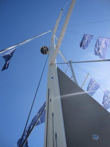 2025 Jeanneau Yacht 65 mast and sails against blue sky