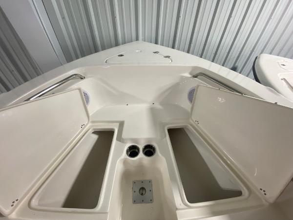 2024 Key West 203 FS boat bow storage compartments and cup holders.
