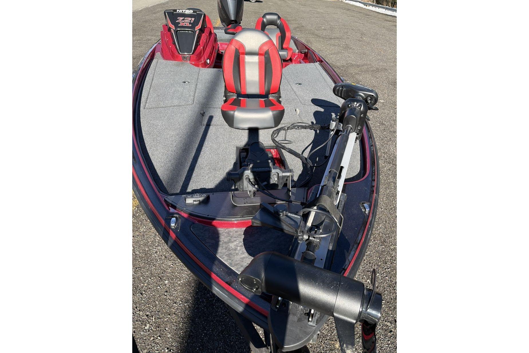 2026 Nitro Z21 XL Pro bass boat with red and gray seating, trolling motor.