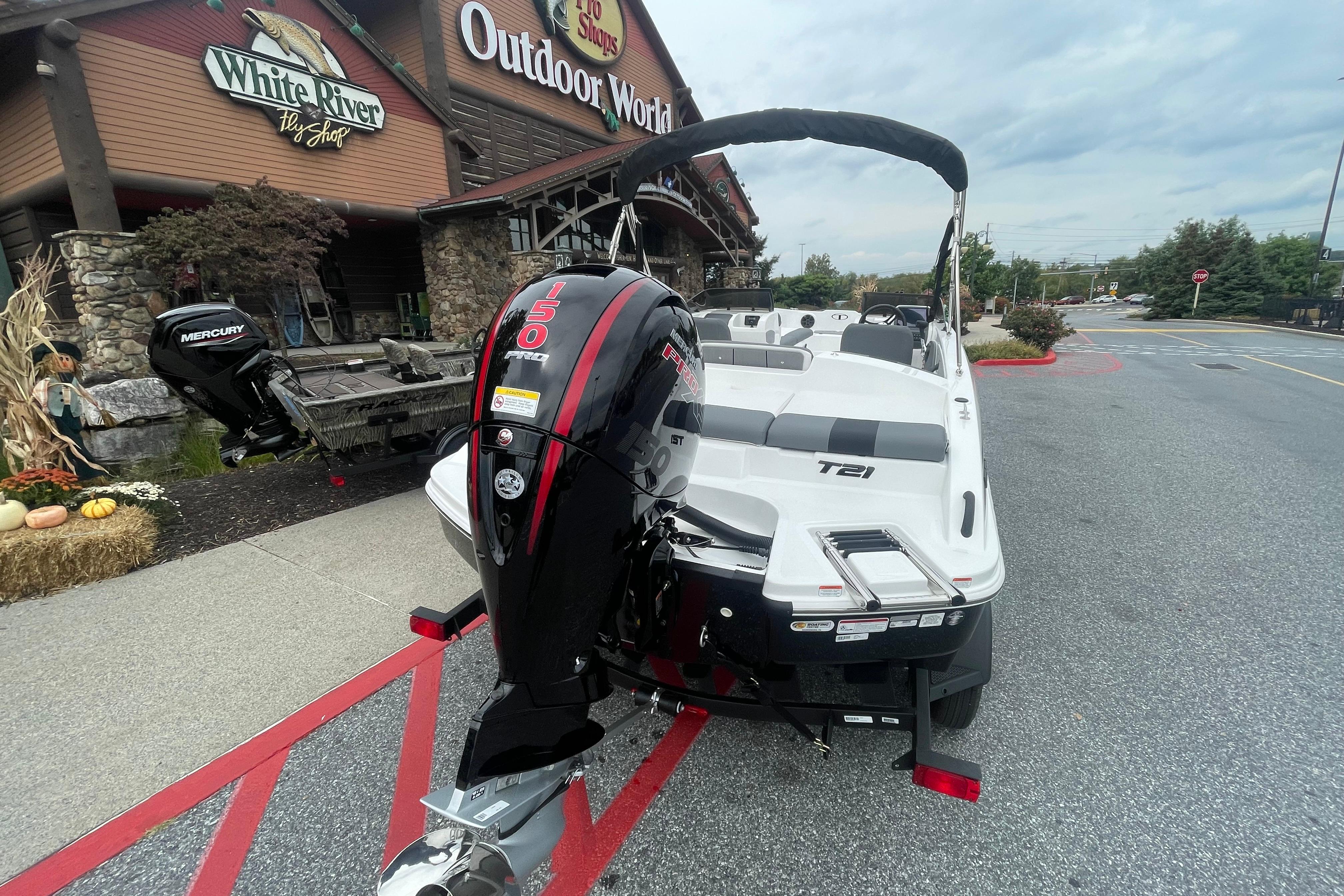 2026 Tahoe T21 boat with Mercury engine outside Bass Pro Shops.