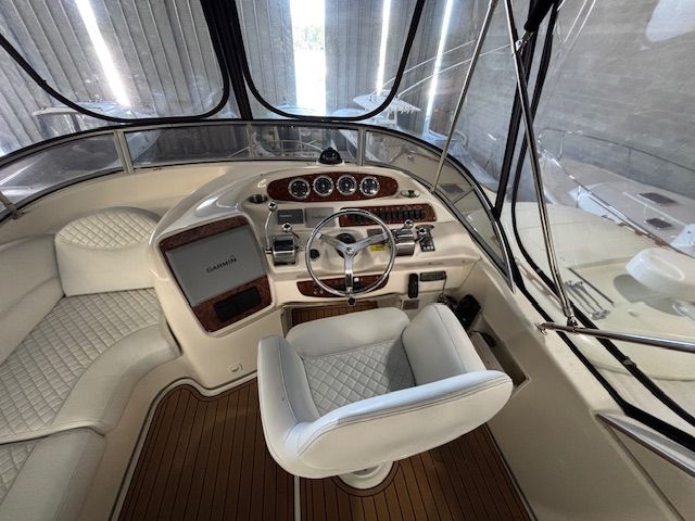 The image shows the cockpit of a 2004 Meridian 341 Sedan with an elegant helm station.