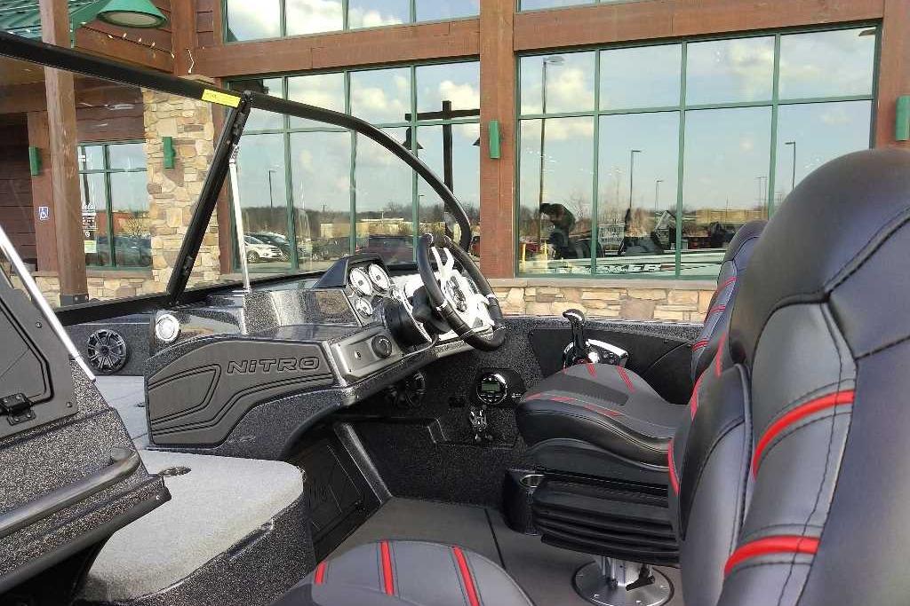 2024 Nitro ZV21 Pro boat interior with sleek black and red seating, modern dashboard.