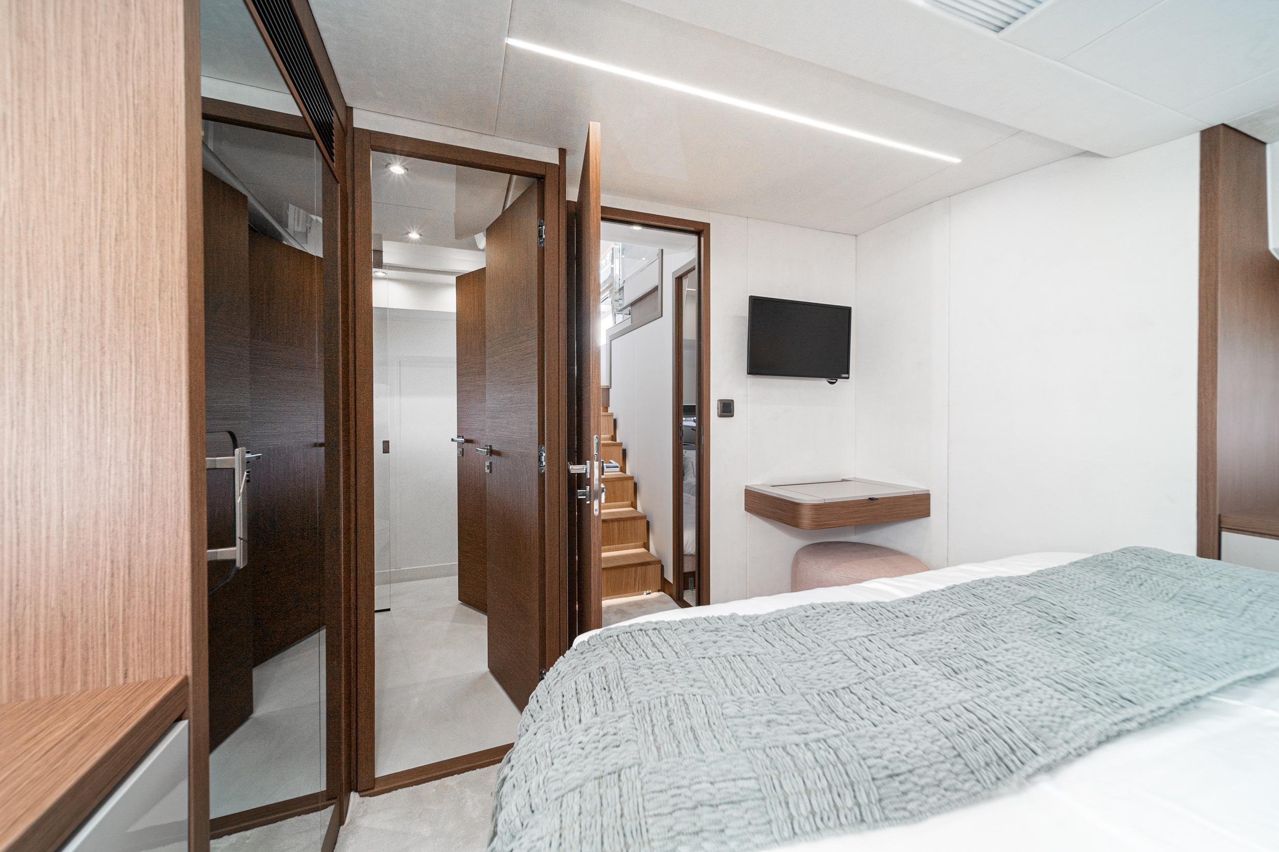 Luxurious interior of 2024 Prestige X60 yacht with modern design and wooden accents.