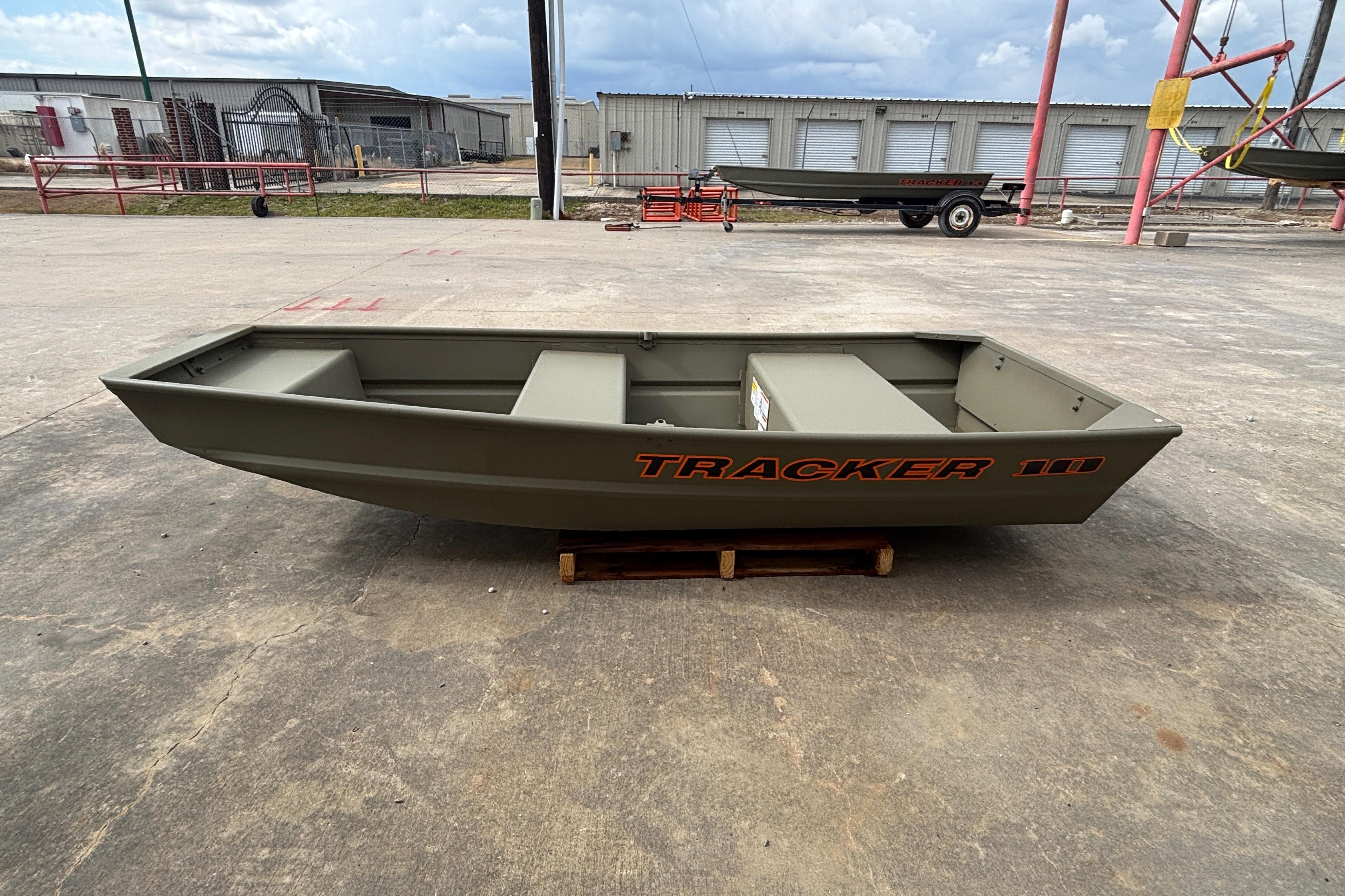 2026 Tracker Grizzly 10 Jon boat on concrete, showcasing its compact design.