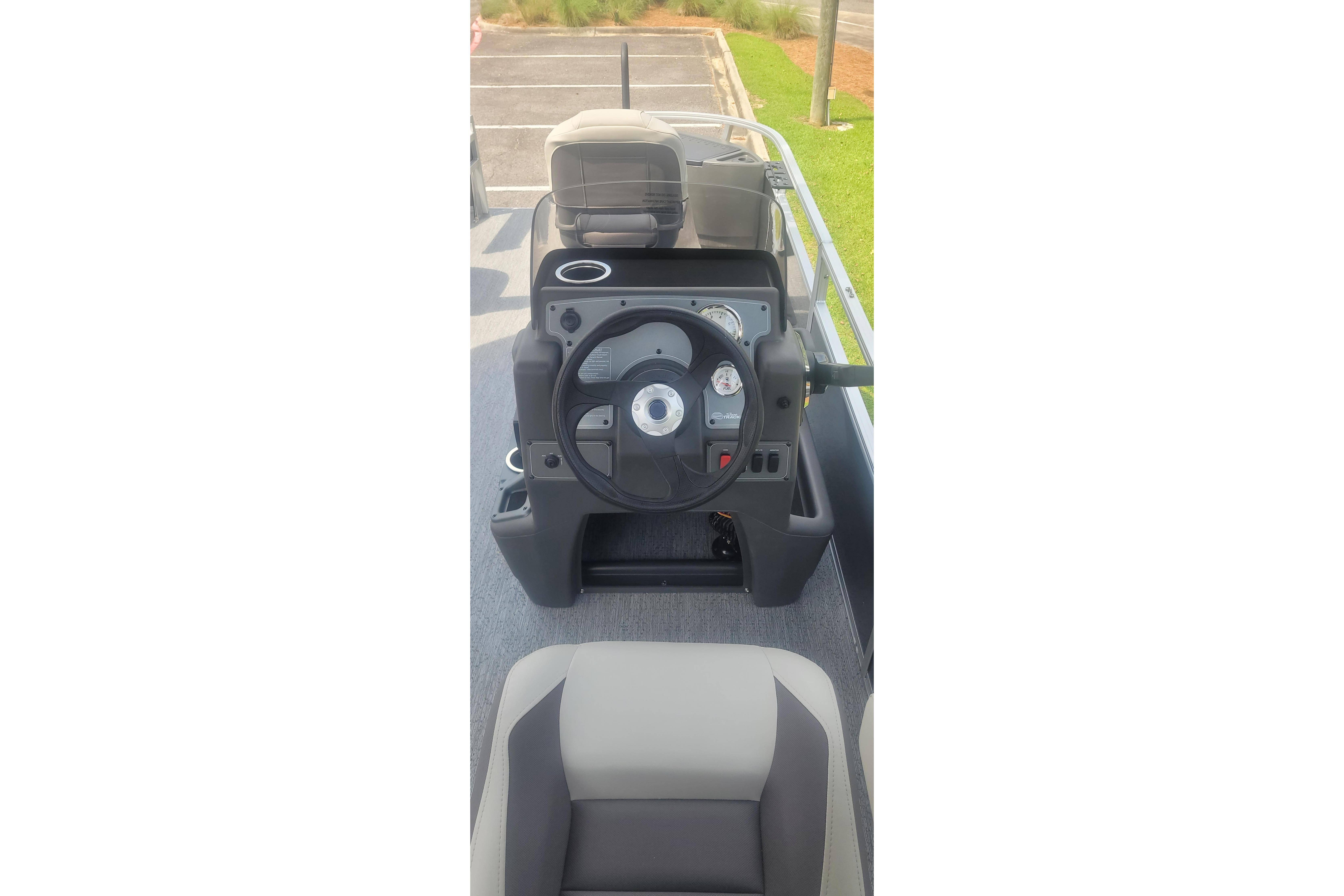 2026 Sun Tracker Bass Buggy 18 DLX steering console with gauges and controls.