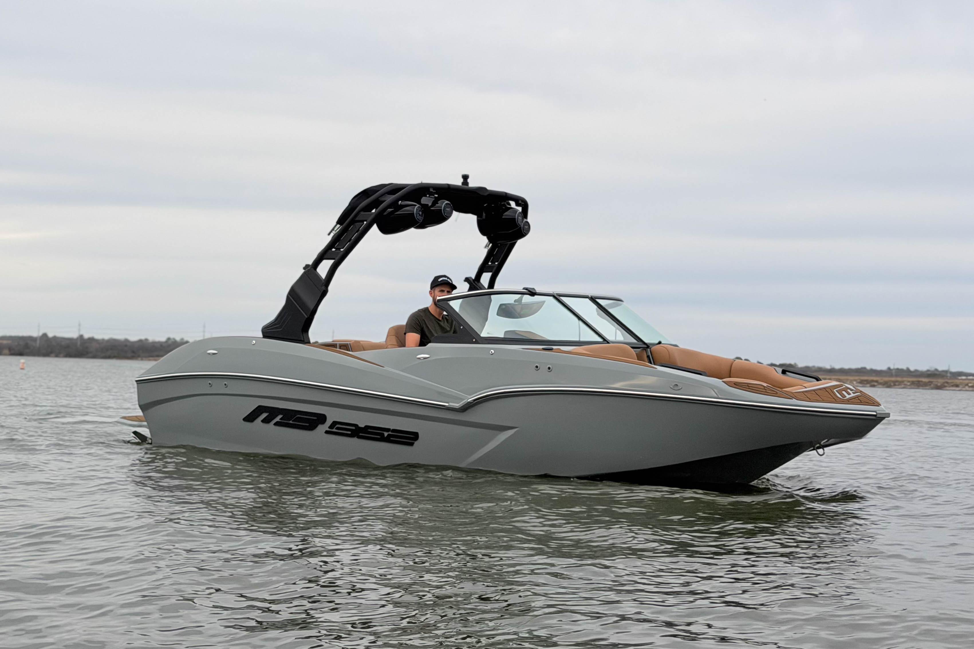 2026 MB B52 21 Alpha boat on water, featuring sleek design and modern amenities.