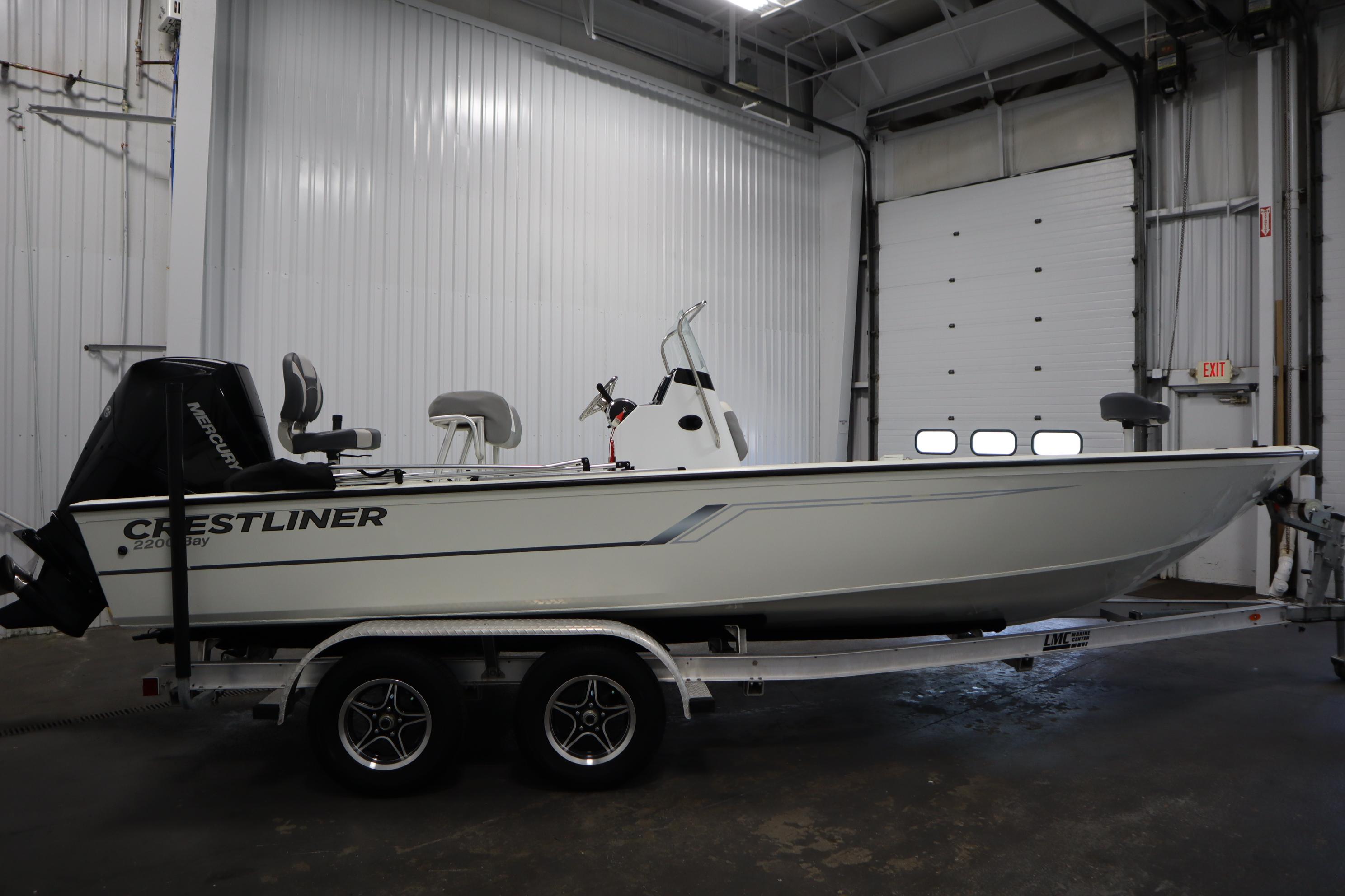 2022 Crestliner 2200 CC boat on trailer in indoor storage facility.