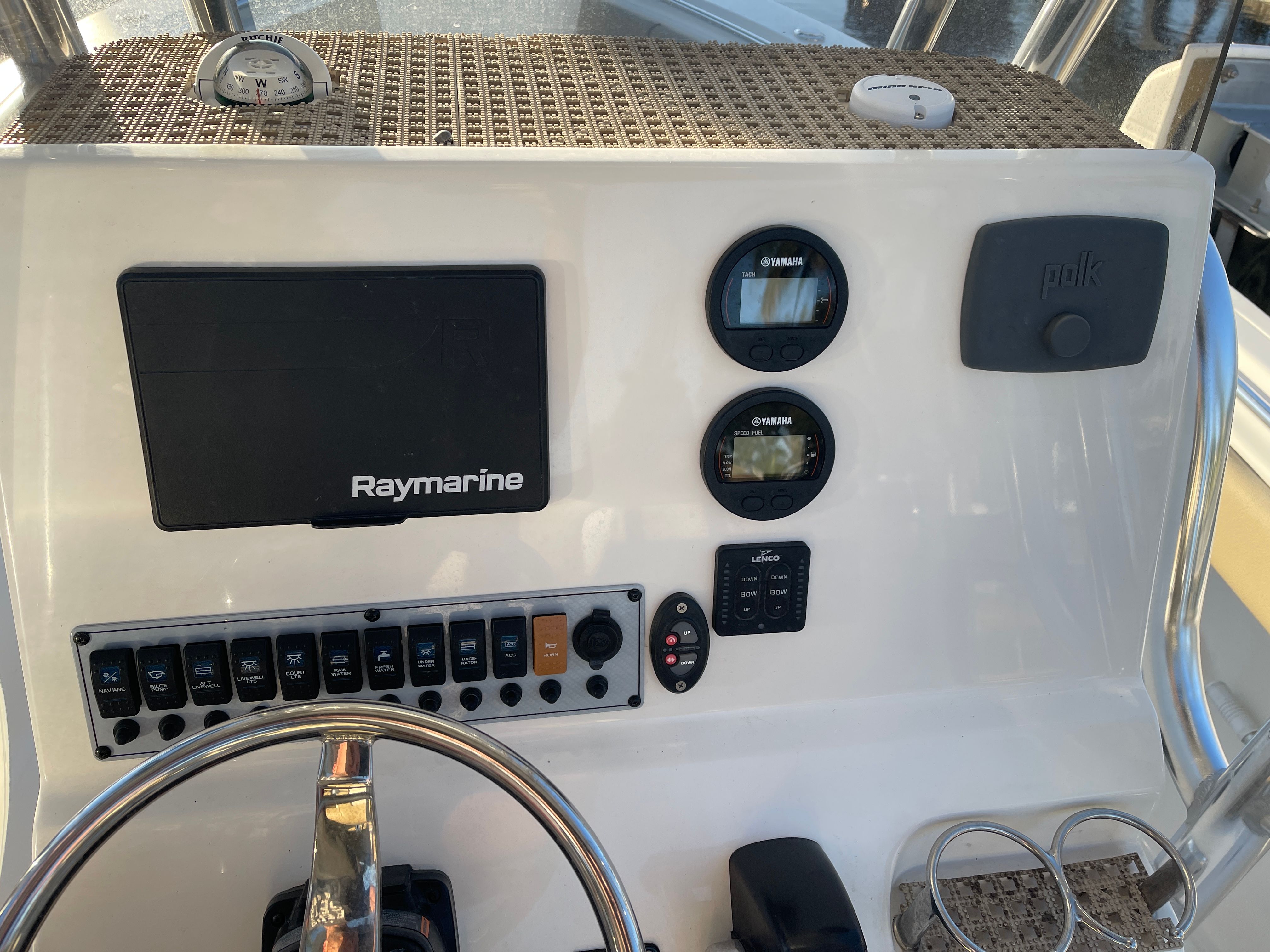 The image shows the dashboard of a Key West 239 FS boat with various instruments.