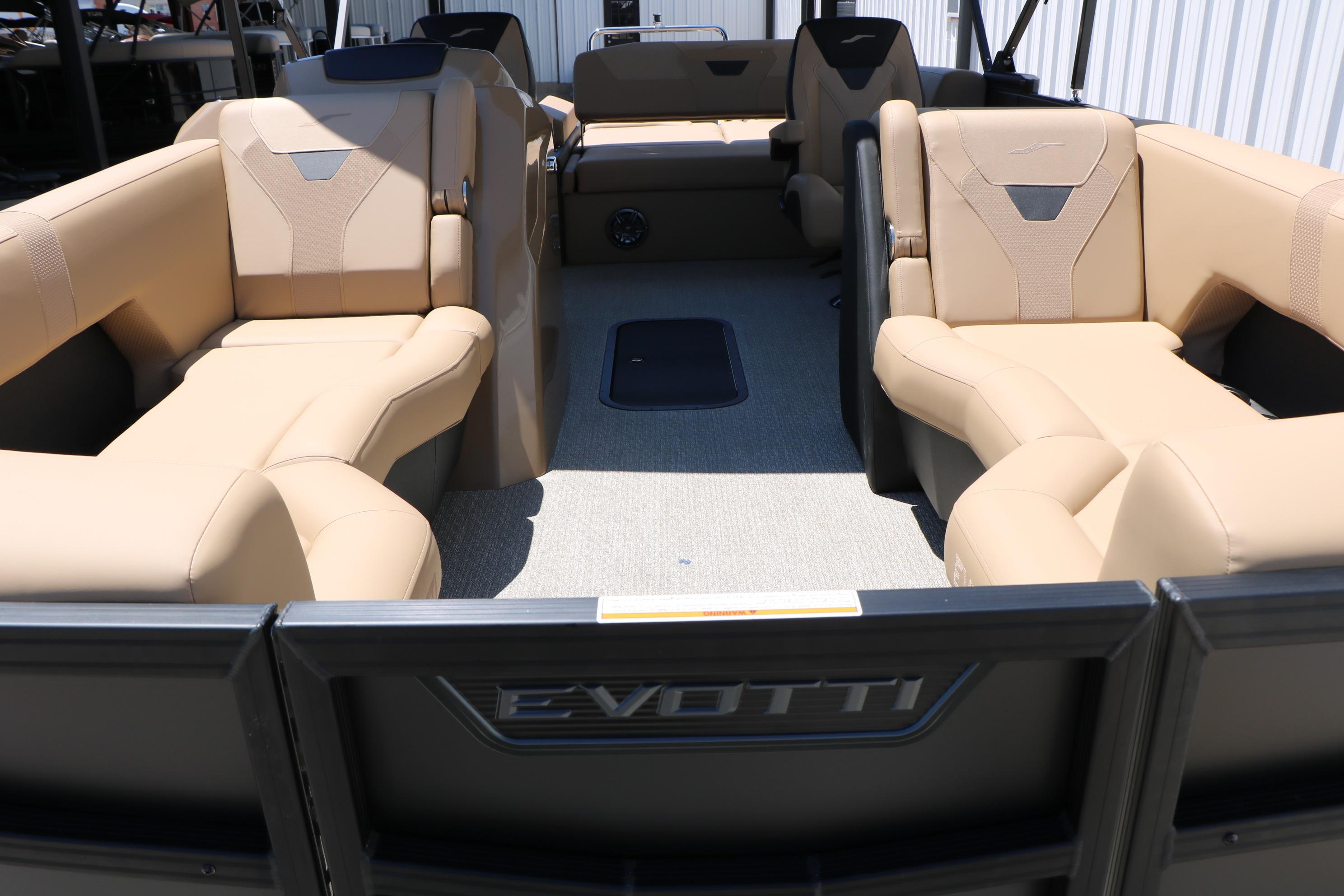 Luxurious interior of 2026 Evotti 521CS boat with beige seating and modern design.