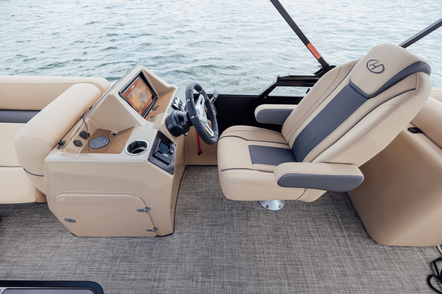 The image shows the cockpit of a 2026 Harris Cruiser 230 with a modern helm station.