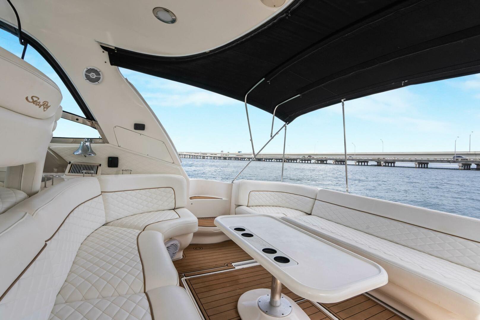 Luxurious interior of 2003 Sea Ray Sundancer 460 yacht with waterfront view.