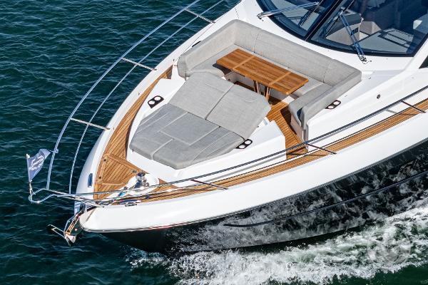 Sunseeker Manhattan 68 yacht, 2025 model, cruising on water with luxurious deck seating.