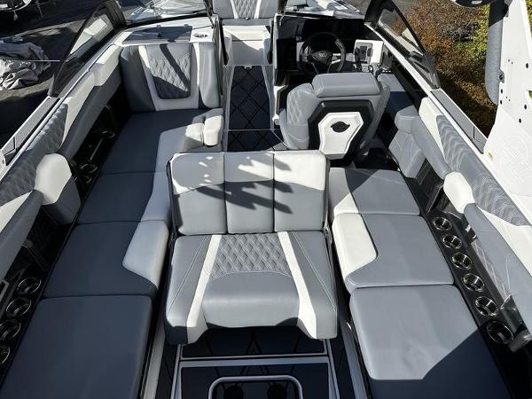 2025 Malibu M230 boat interior with luxurious gray seating and modern design.