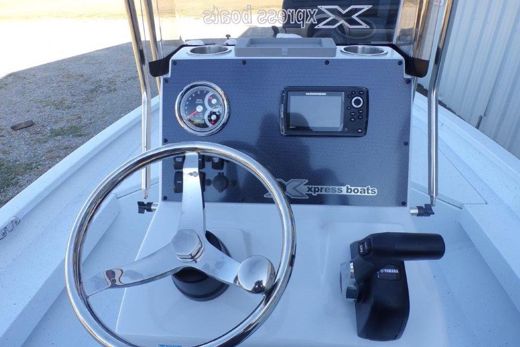 2026 Xpress H20B Bay boat dashboard with steering wheel and navigation system.