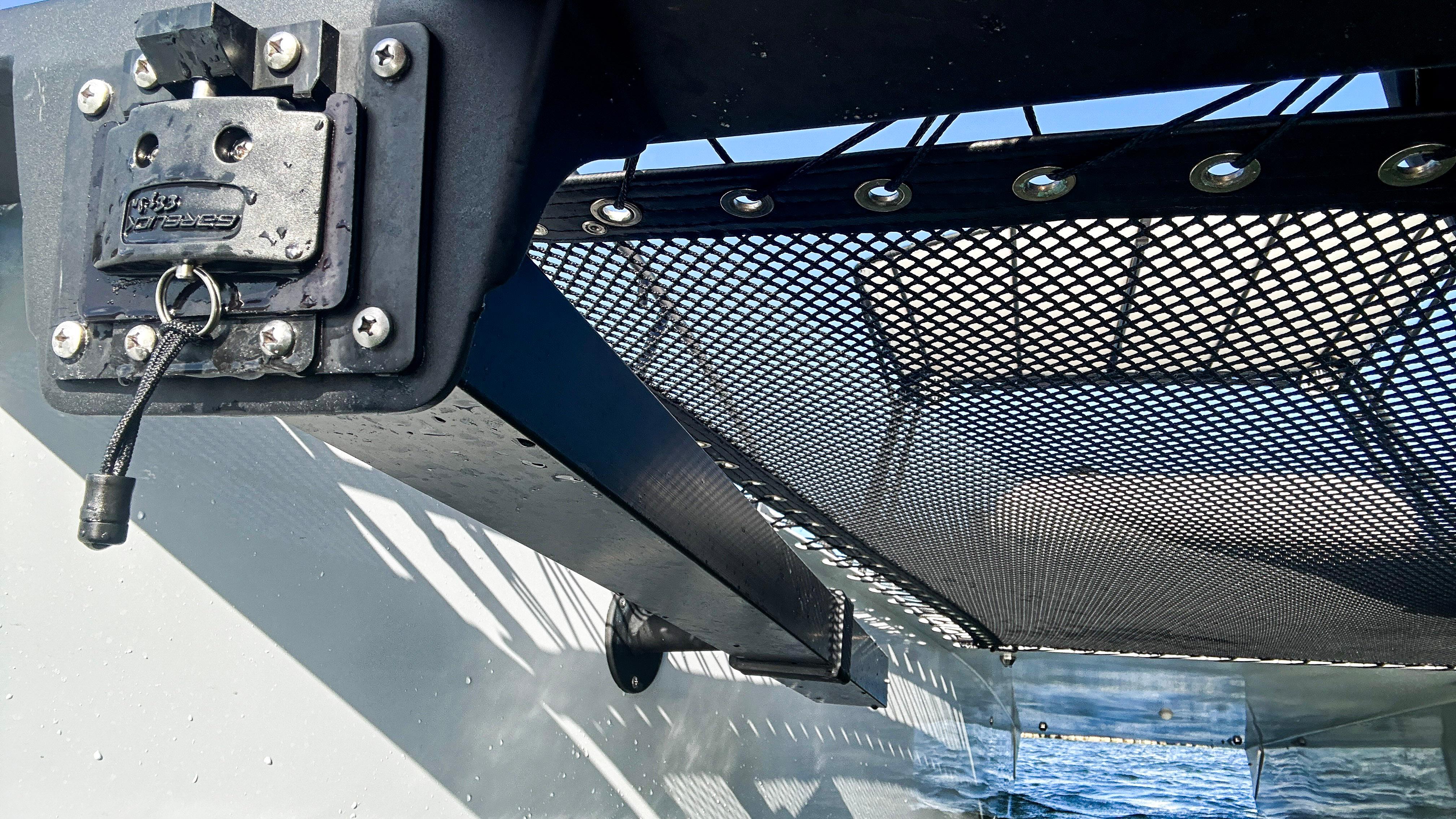 2025 Pontoon Harpoon boat with mesh netting and secure latch system.
