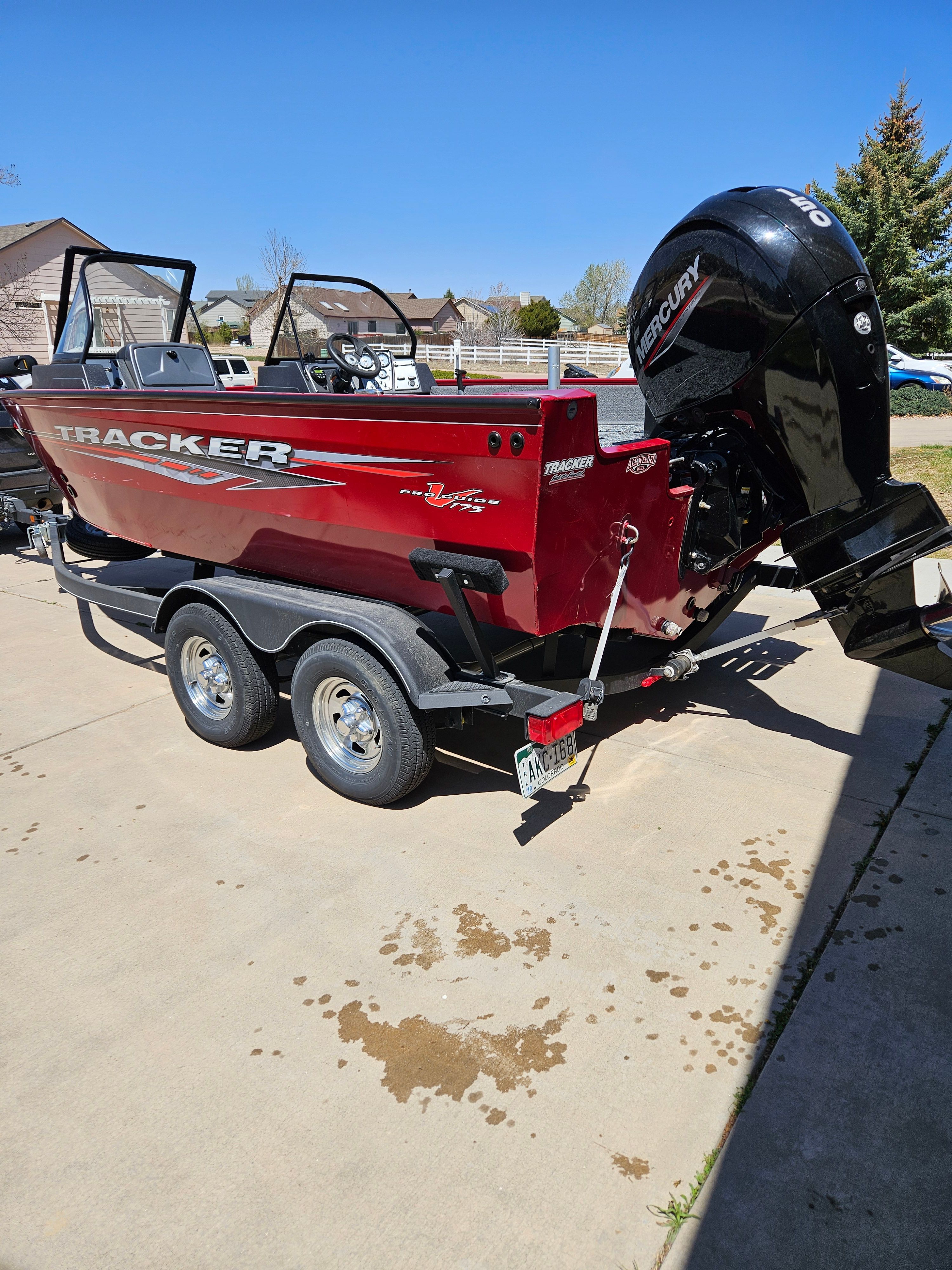 Red Tracker Pro Guide V-175 WT boat on trailer, year 2021.