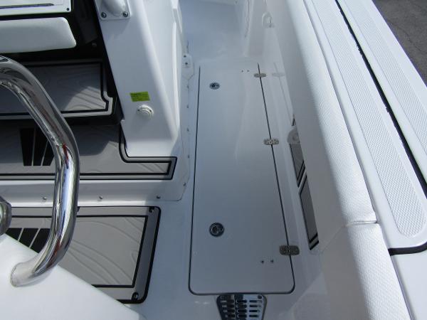 2024 Wellcraft 263 Fisherman boat deck with storage compartments and seating.