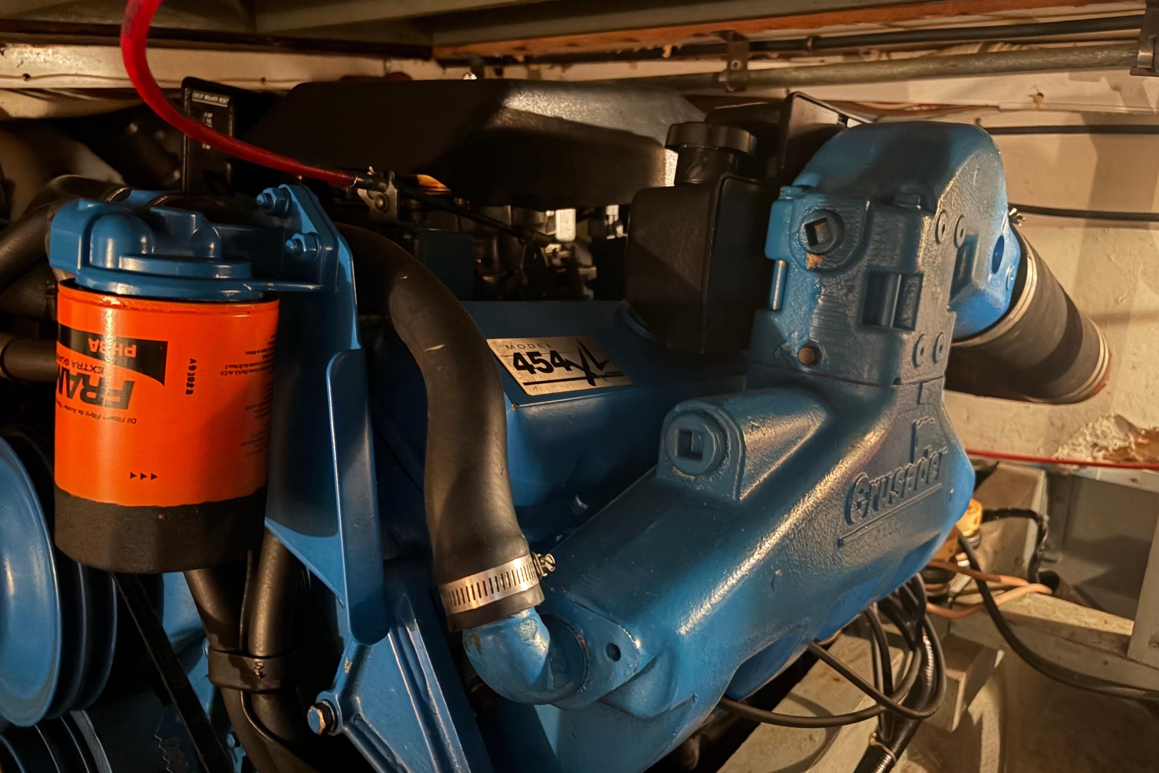1971 Chris-Craft 42 Commander engine, featuring a blue Crusader 454 motor with Fram oil filter.