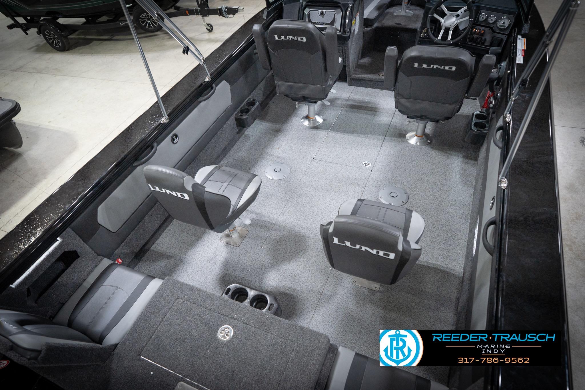 2026 Lund 2275 Baron boat interior with seating and steering console, showcased at Reeder-Trausch Marine.