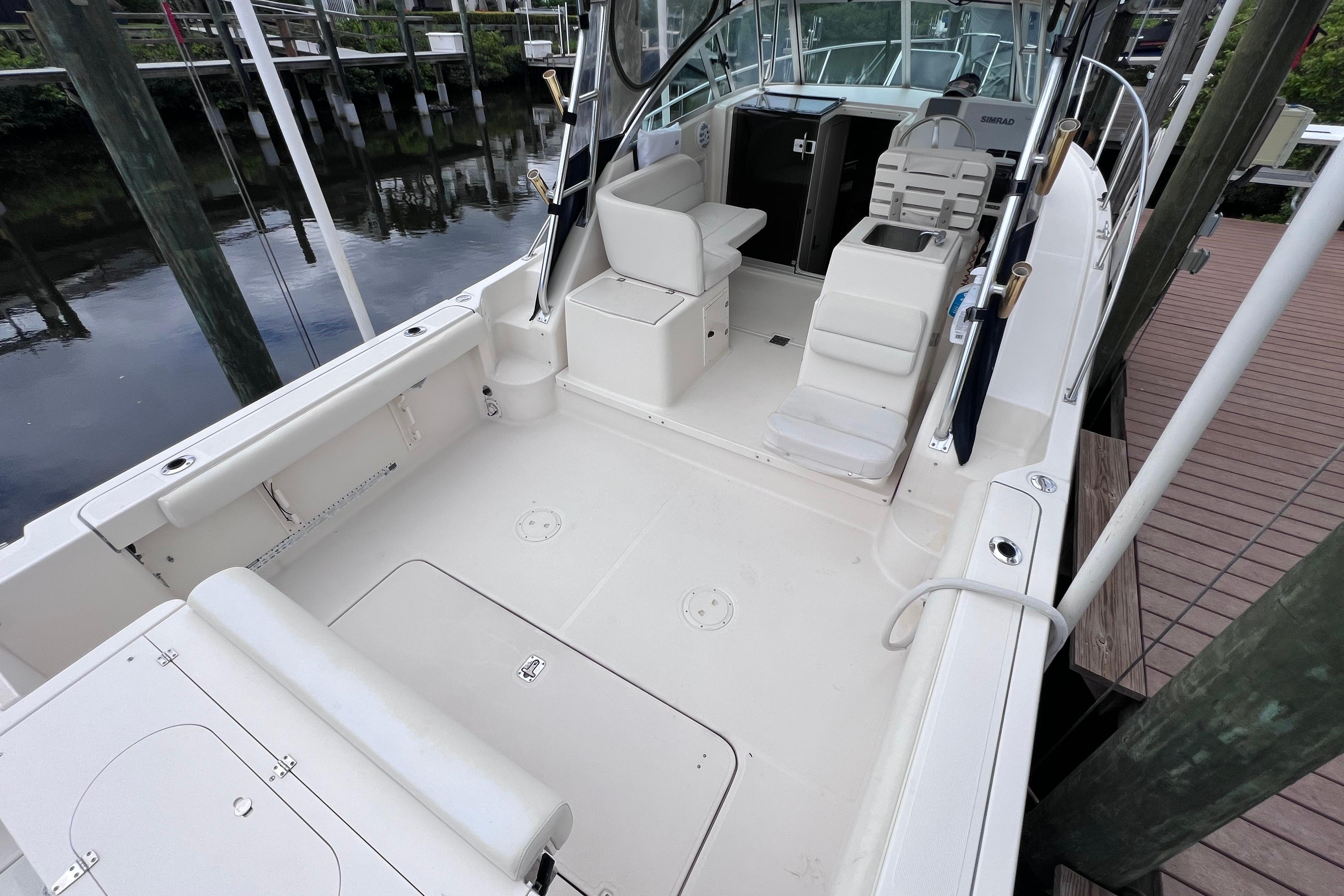 2005 Pursuit 3070 Offshore boat interior, featuring spacious seating and clean deck design.