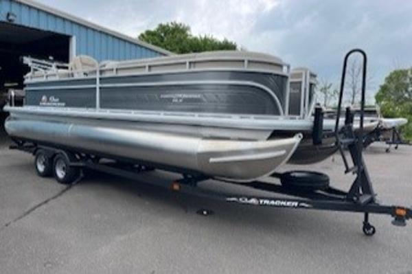 2024 Sun Tracker Party Barge 24 DLX pontoon boat on a trailer.