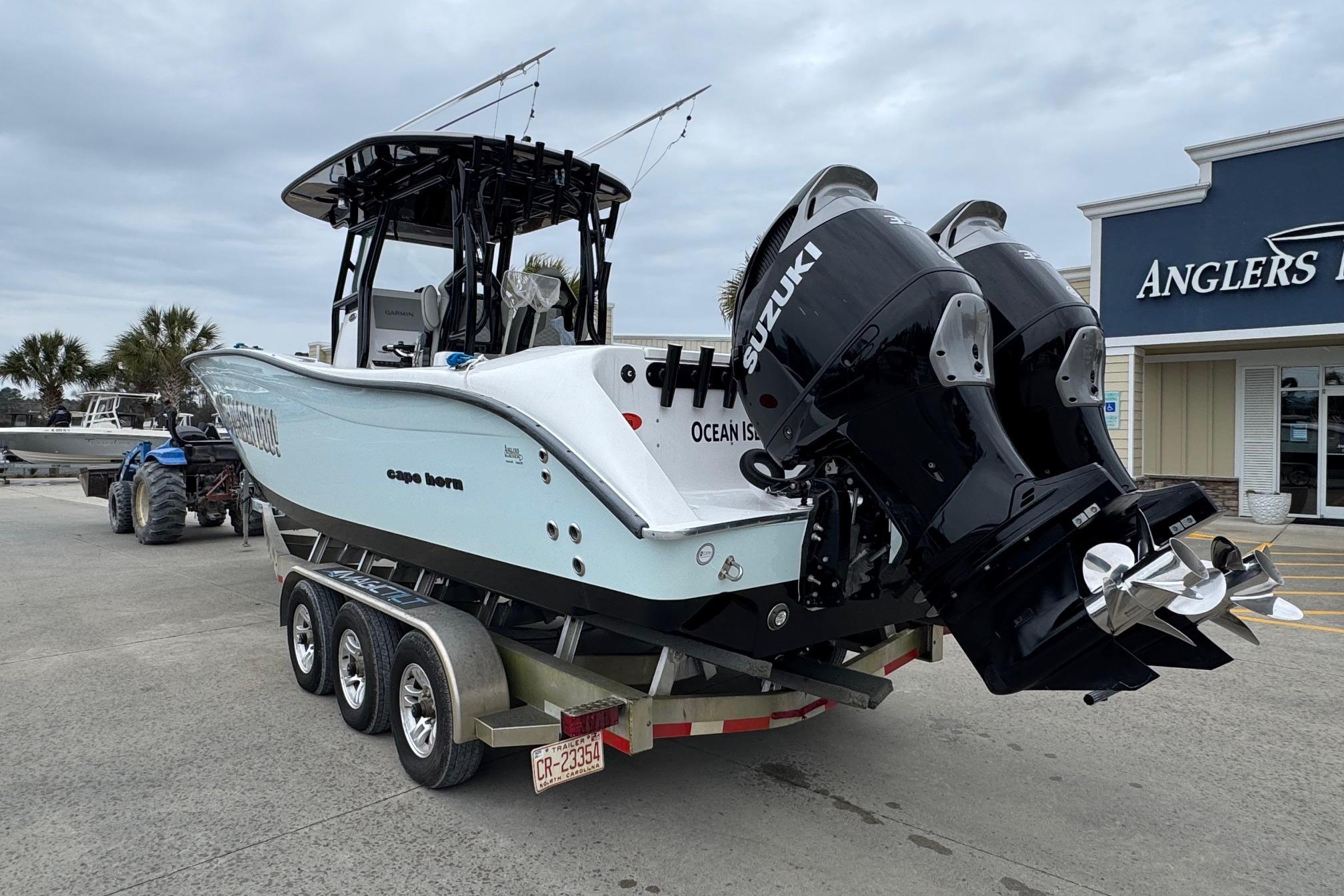 2024 Cape Horn 32 XS boat with dual Suzuki engines on a trailer.