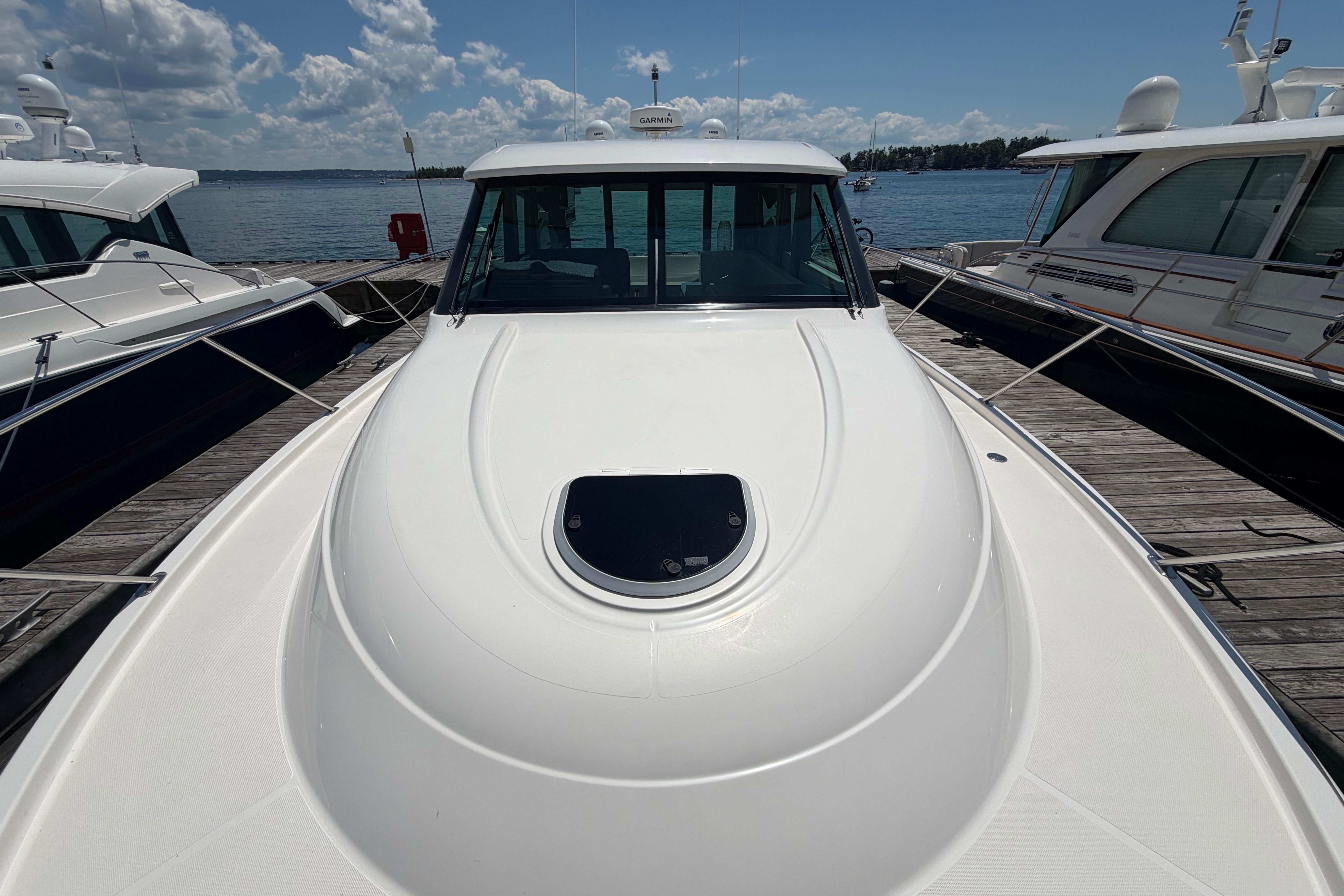 2016 Tiara Yachts C39 Coupe docked, showcasing sleek design and spacious deck.