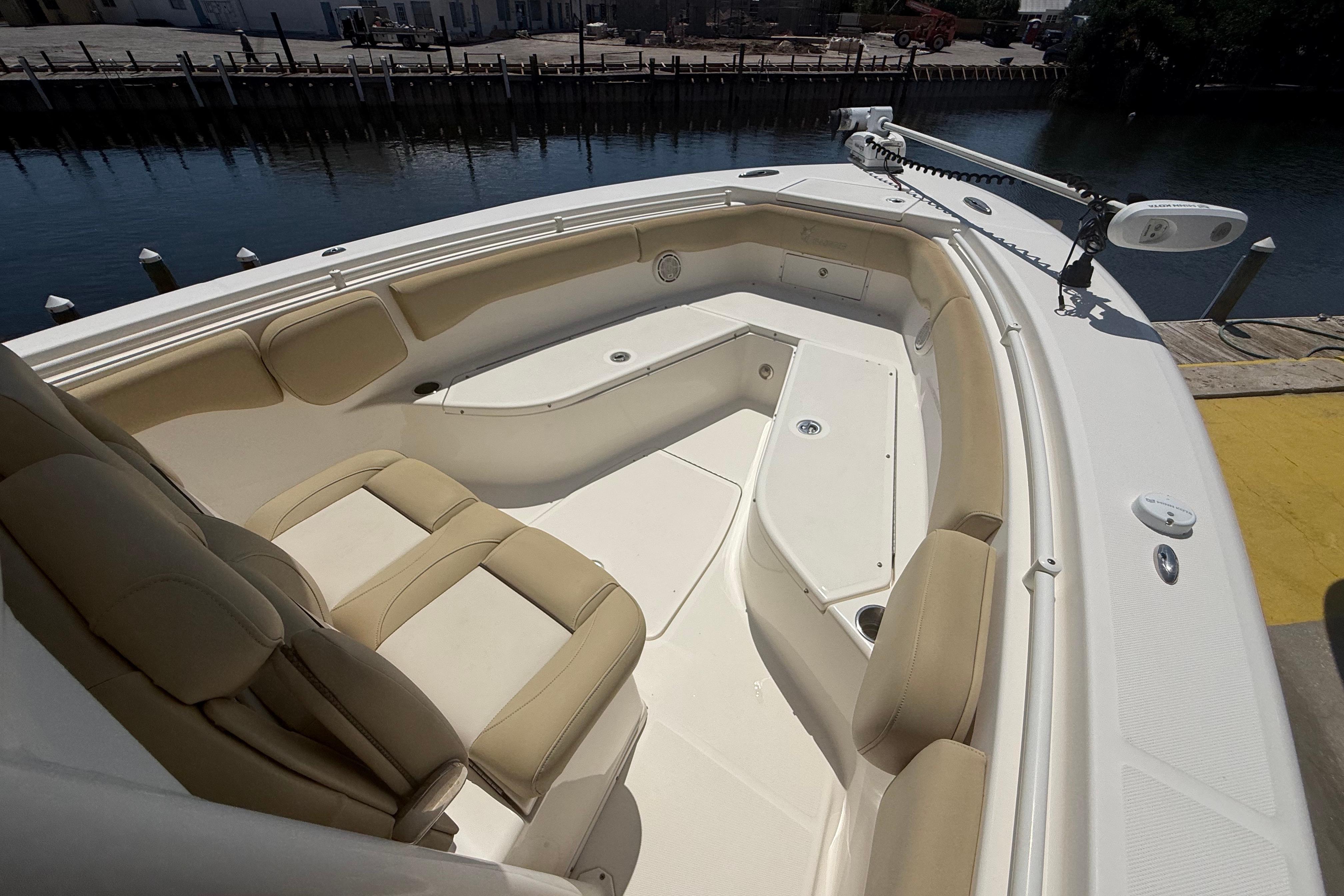 2019 Key West Billistic 281 Center Console boat with beige seating and spacious deck.
