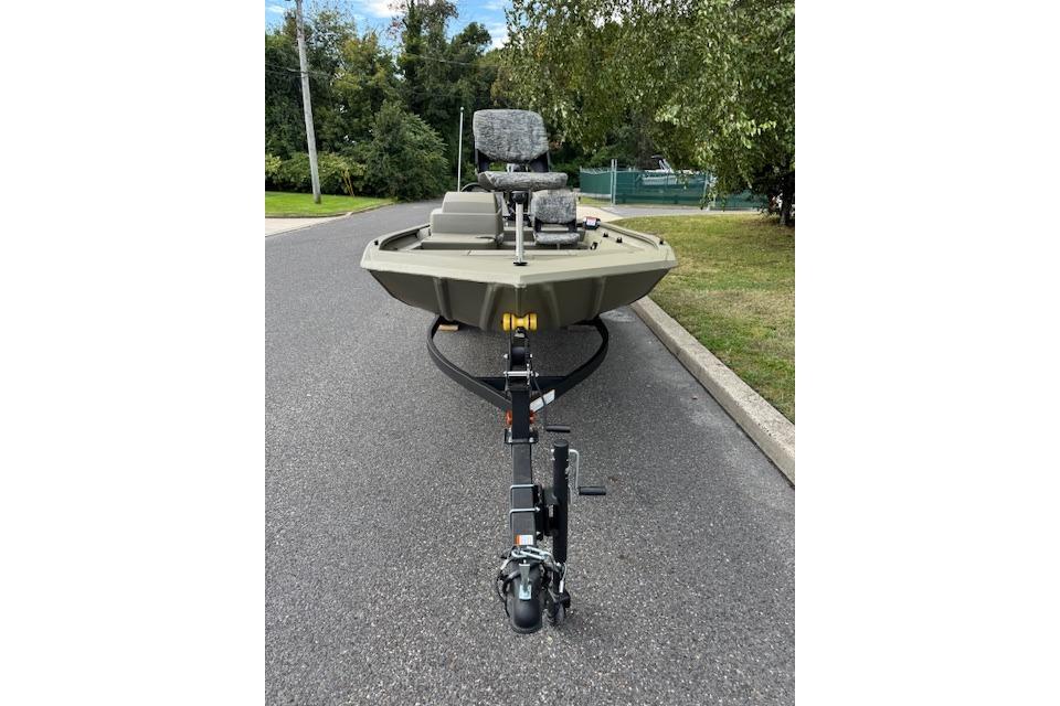 2026 Tracker Grizzly 1754 SC boat on trailer, parked on a suburban street.