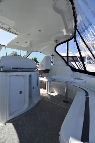 2010 Cruisers Yachts 390 Sports Coupe interior with seating and cabinetry.