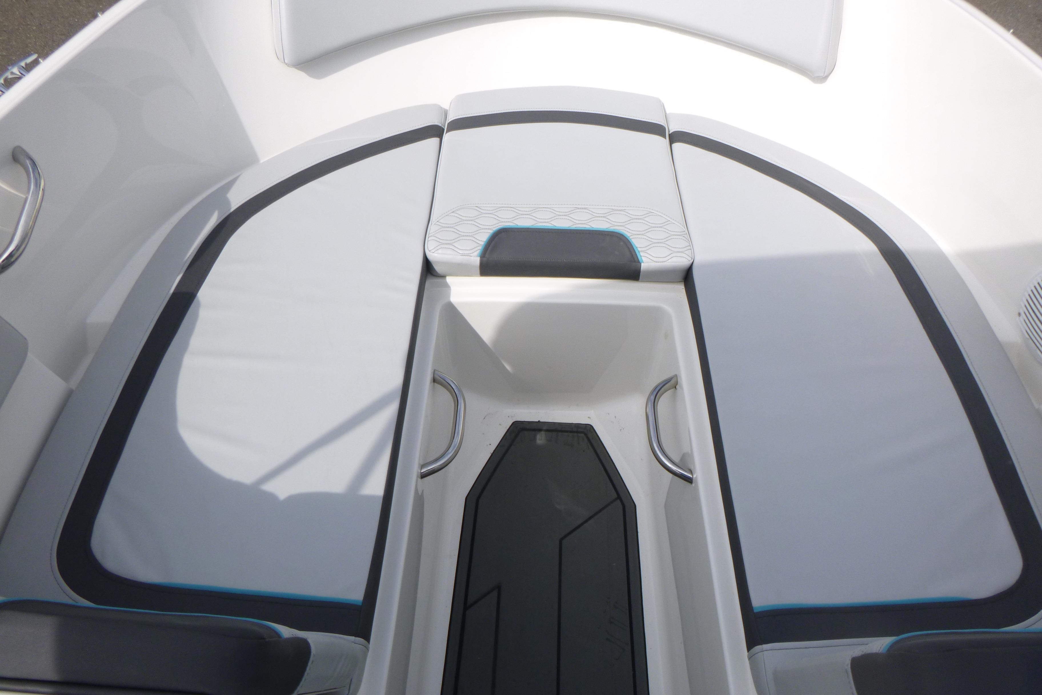 2022 Bayliner Element M17 boat interior with cushioned seating and storage area.