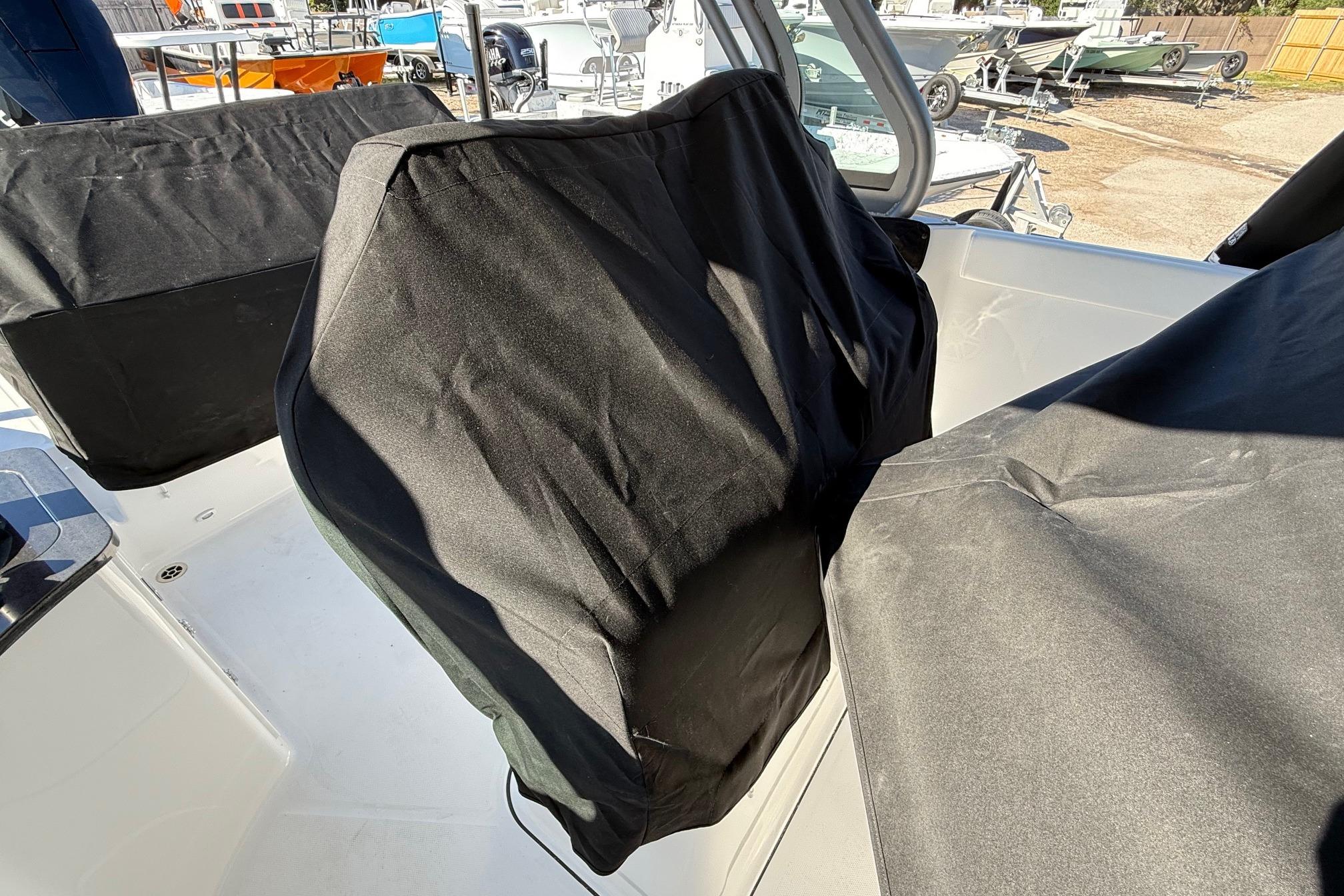 Covered seats on a 2026 Monterey Elite 27 OB boat.