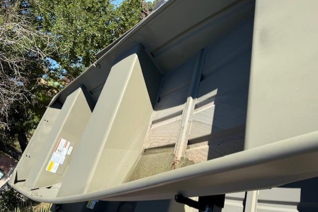 2026 Tracker Grizzly 12 Jon boat interior with bench seats and open deck.