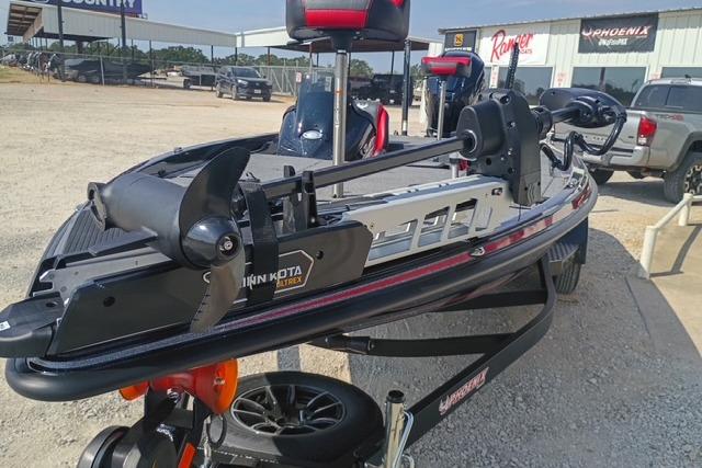 2026 Phoenix 721 ZXL boat with Minn Kota trolling motor in a dealership lot.