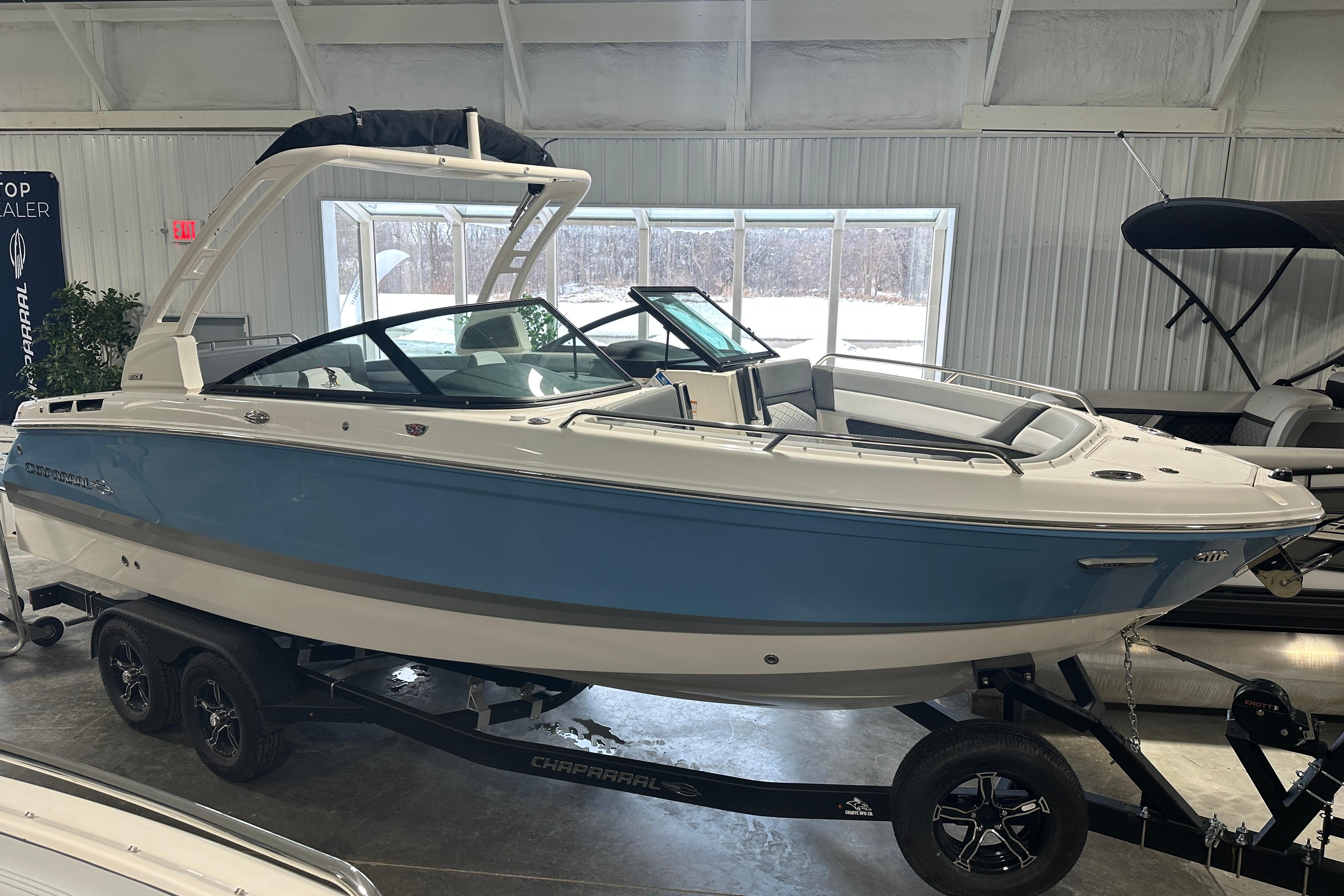 2026 Chaparral SSX 6 boat displayed in a showroom.
