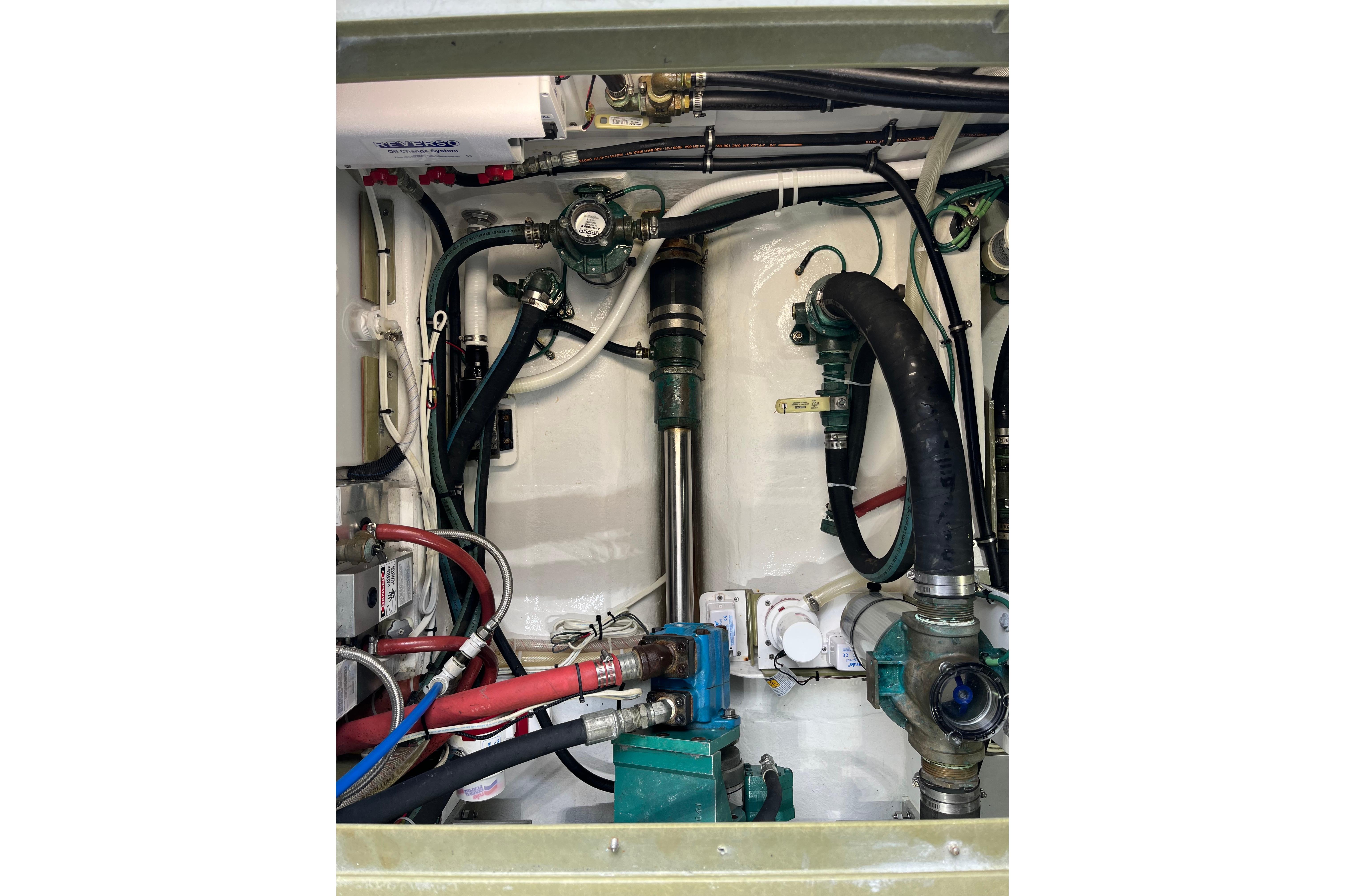 Engine room of 2018 H&H Marine Osmond Beal boat, showcasing complex piping and machinery.