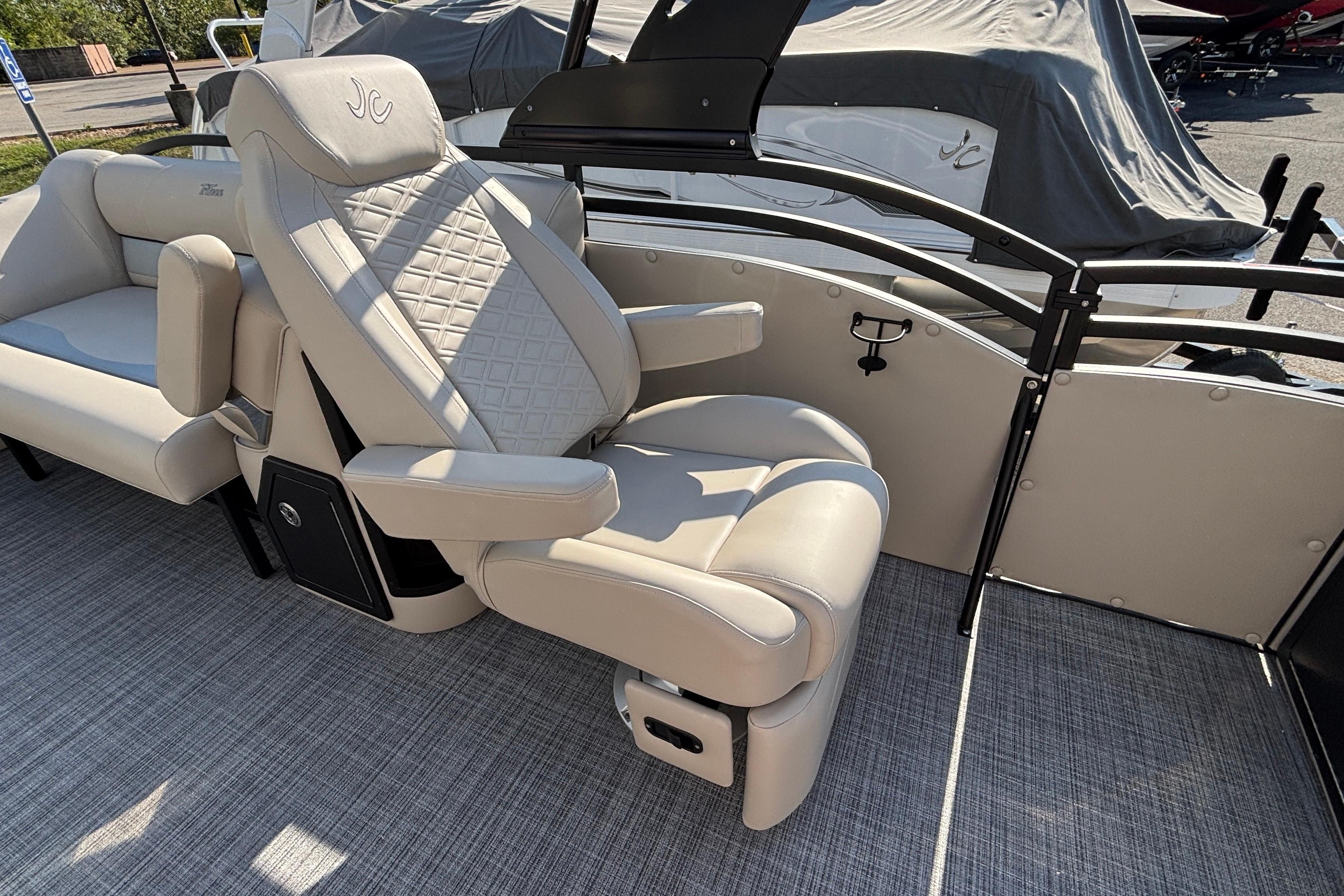 Luxurious seating on 2026 JC Neptoon 25TT Sport pontoon boat, featuring elegant design and comfort.