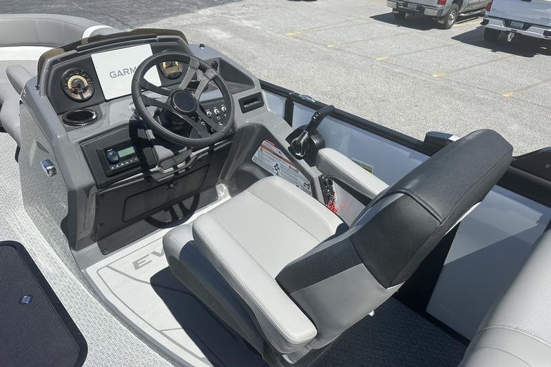 Interior of 2026 Evotti 523QL boat with steering wheel and control panel.