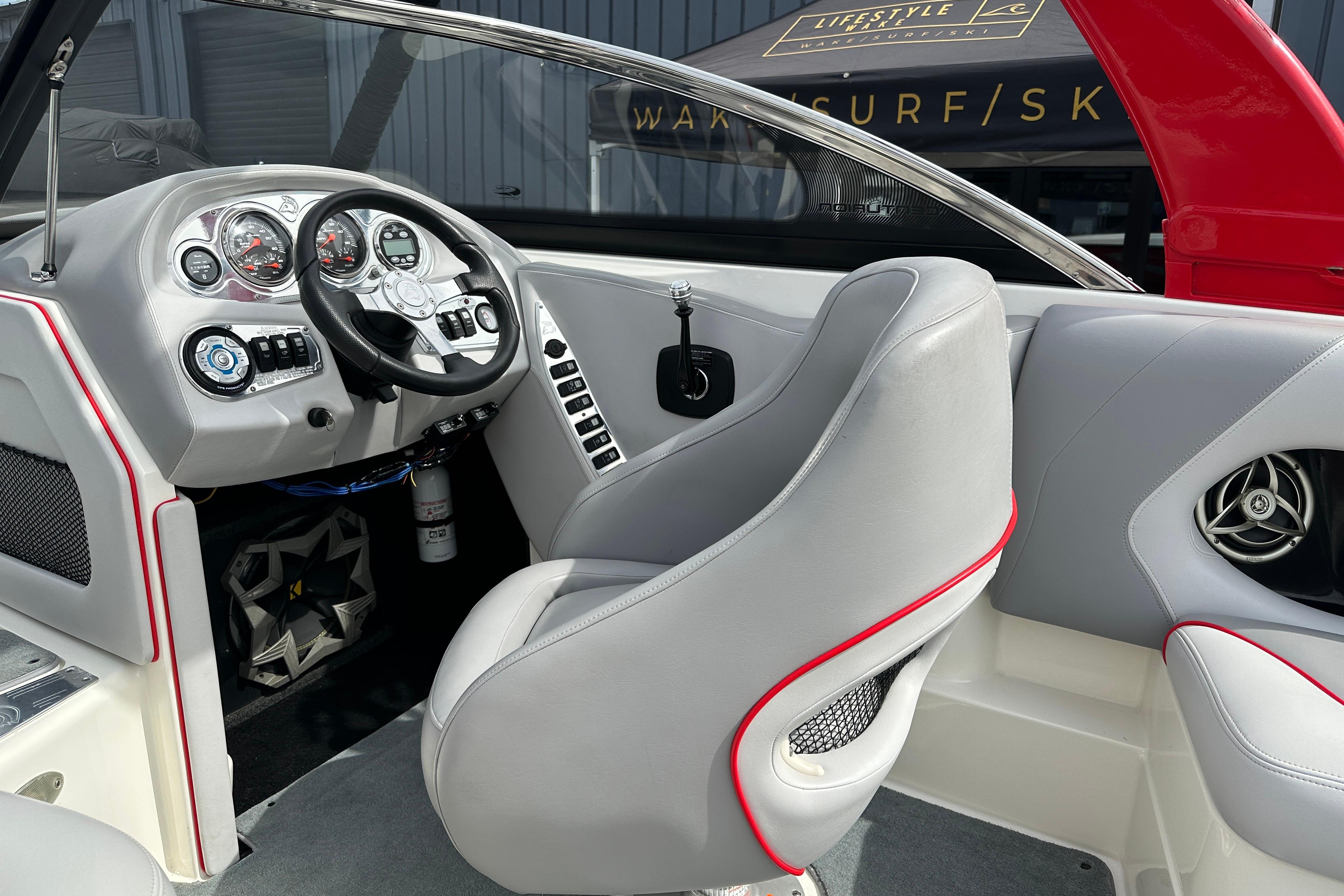 2008 Centurion Enzo SV240 boat interior with steering wheel and dashboard controls.