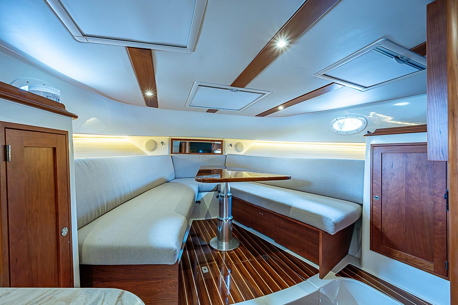 Luxurious interior of 2023 Hinckley Sport Boat 40 X with elegant wood finishes.