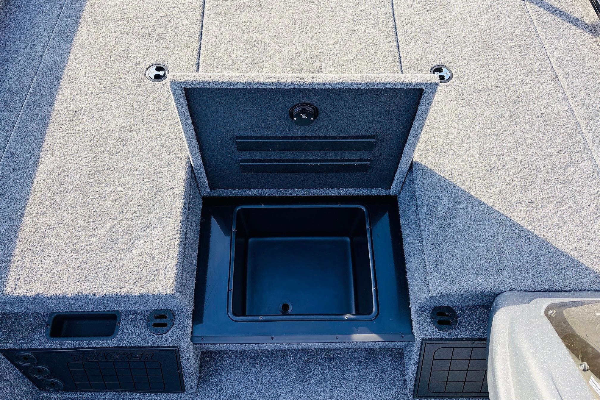 2025 Tracker Savage 215 boat storage compartment with open lid, showcasing interior space.