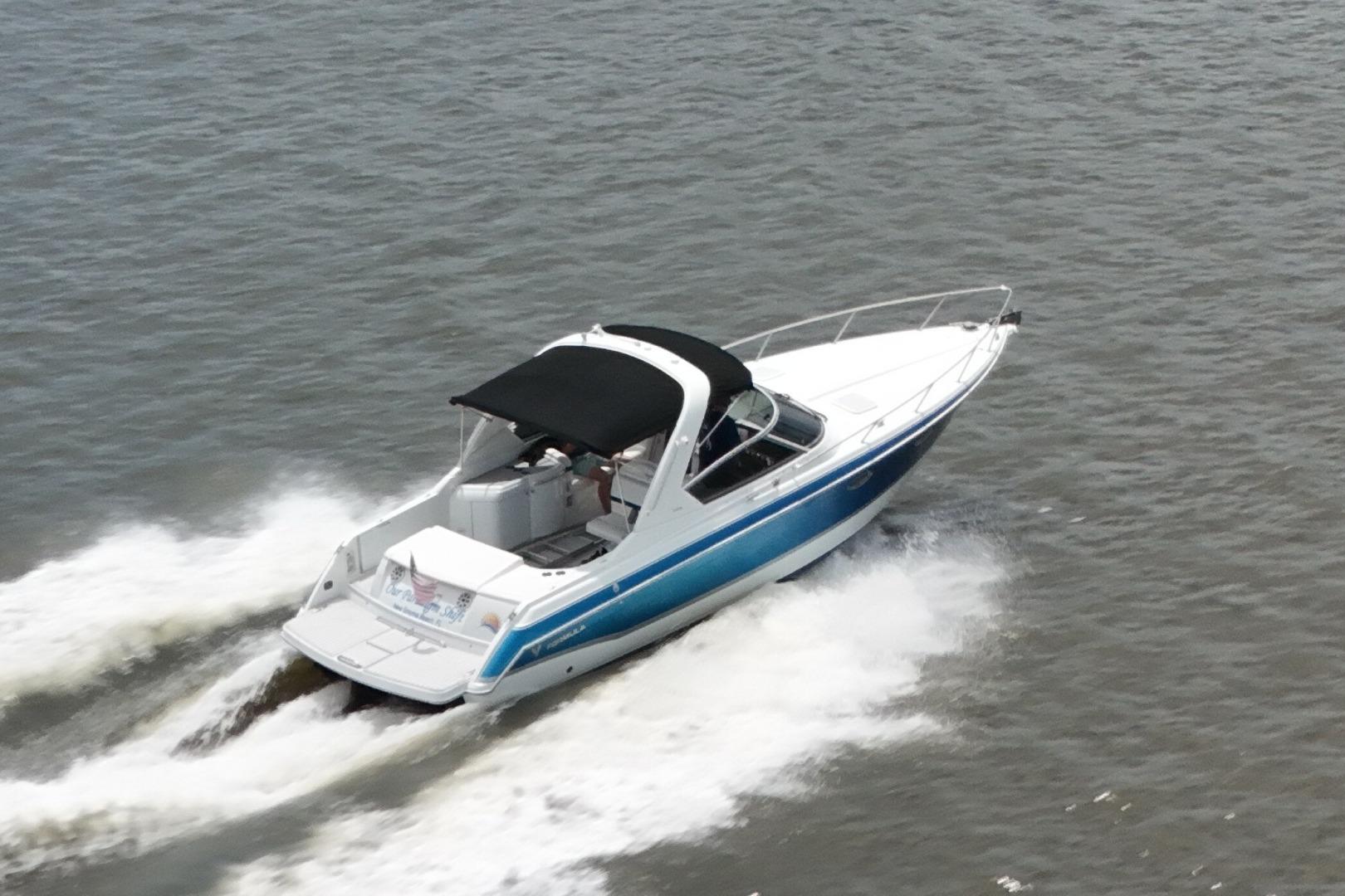 2007 Formula 330 Sun Sport boat cruising on open water.
