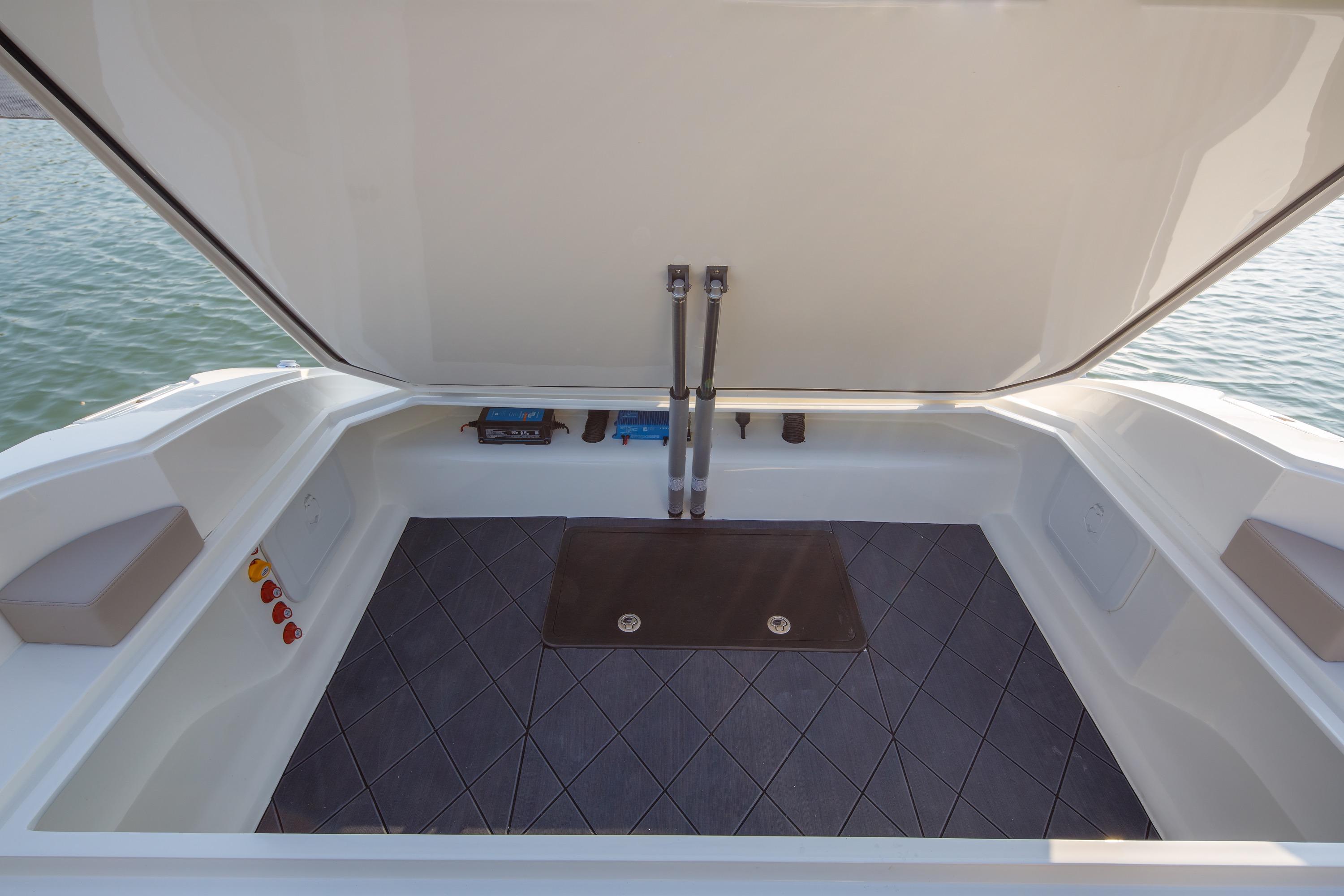 Open storage compartment on 2021 Onda 371GT boat, featuring spacious interior and modern design.
