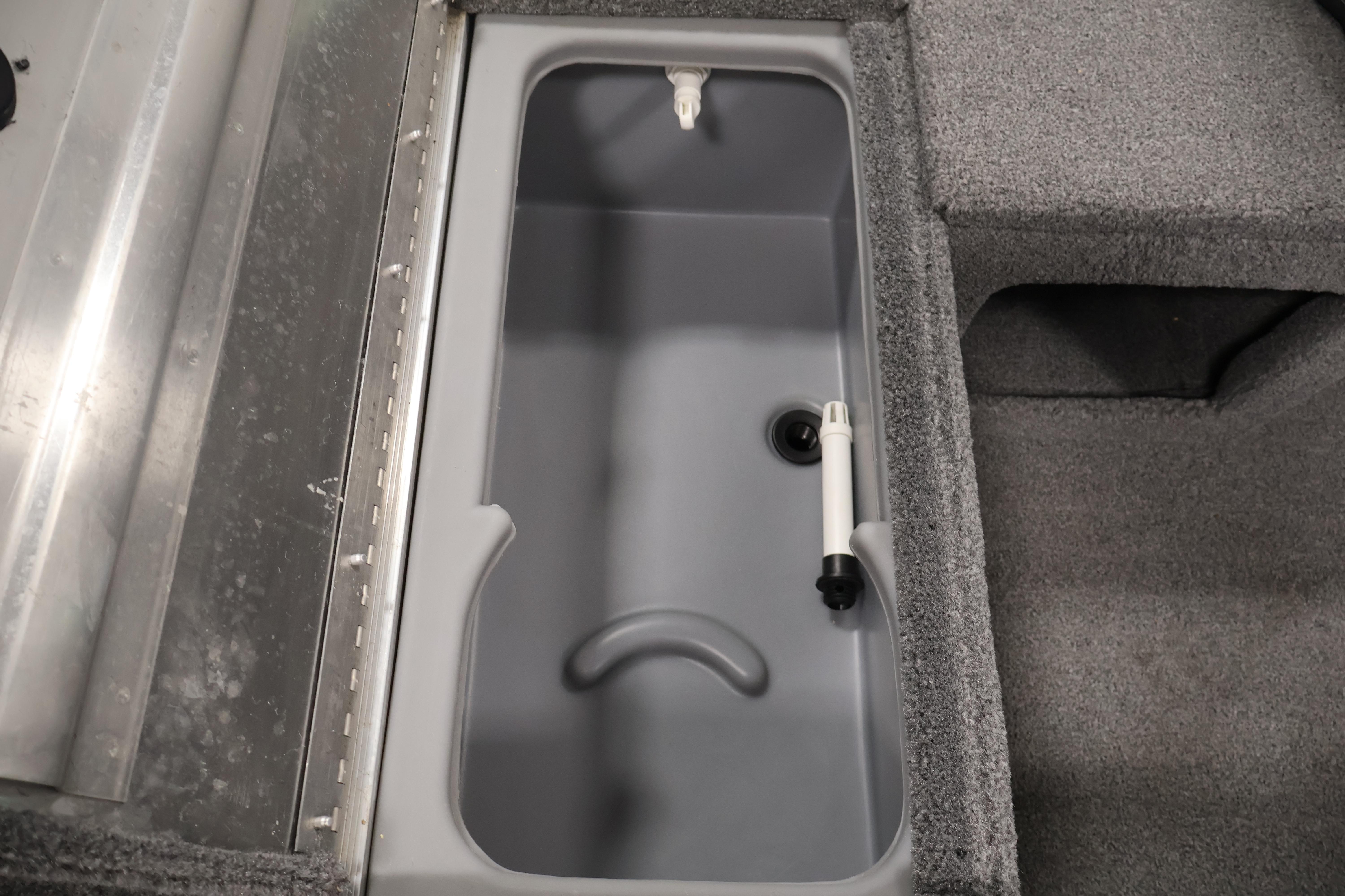 2024 Tracker Pro 170 boat livewell interior with gray finish and plumbing components.