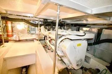 Engine room of 1991 Carver 42 Aft Cabin Motor Yacht, showcasing mechanical components.